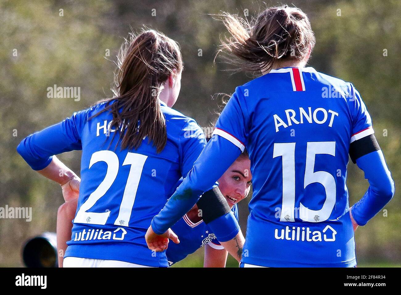 Glasgow, UK. 11th Apr, 2021. Lizzie Arnot (#15) of Rangers Women FC celebrates with Kirsty Howart (#21) of Rangers Women FC & Emma Brownlie (#4) of Rangers Women FC following their opening goal during the Scottish Building Society SWPL1 Fixture Rangers FC vs Spartans FC at Rangers Training Centre, Glasgow, 11/04/2021 | Images courtesy of www.collargeimages.co.uk Credit: Colin Poultney/Alamy Live News Stock Photo