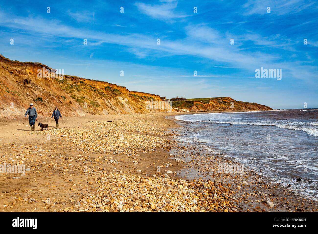 Walking on the beach at Brook Chine Stock Photo