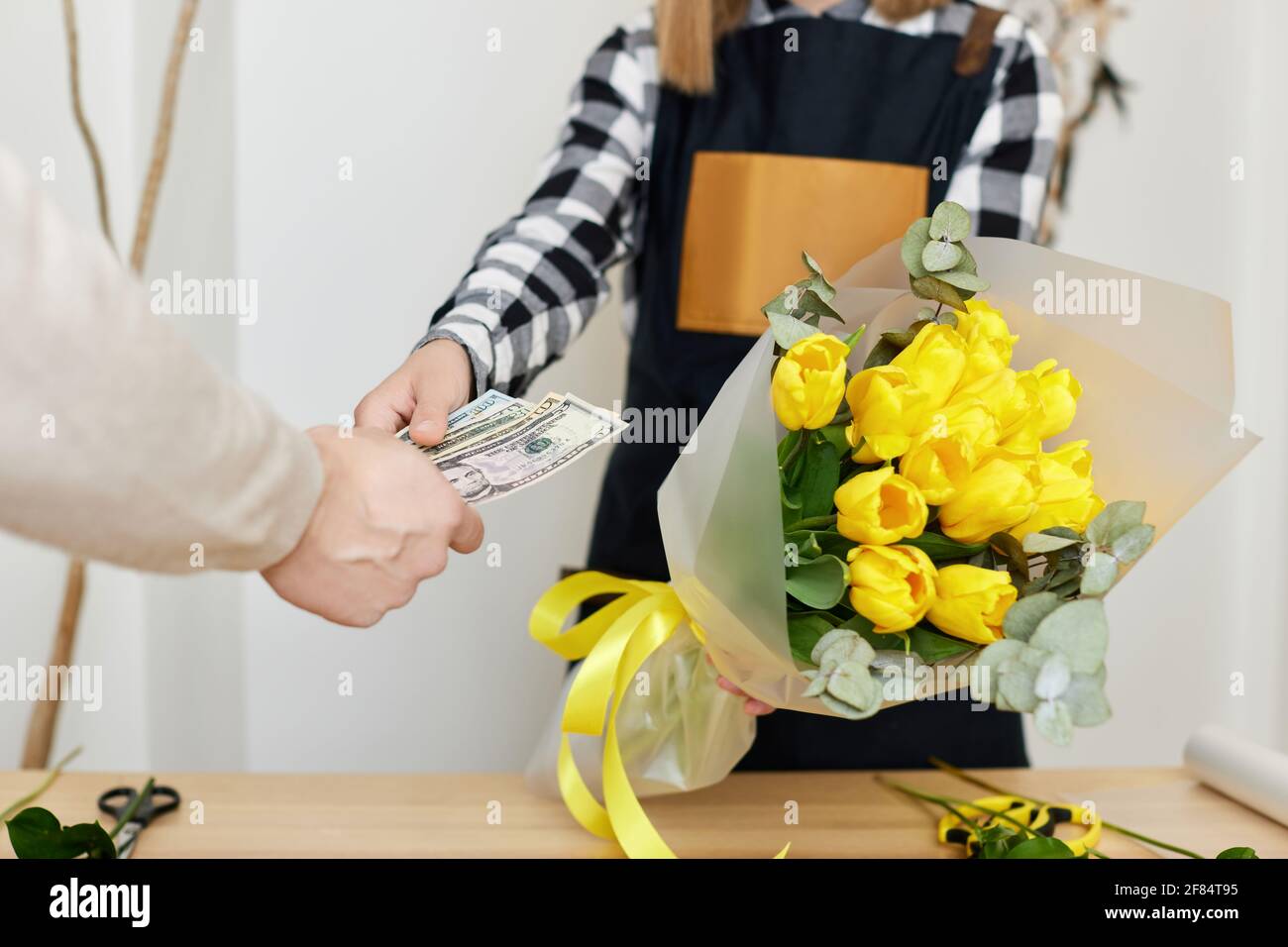 Woman florist selling flowers to a man Stock Photo Alamy