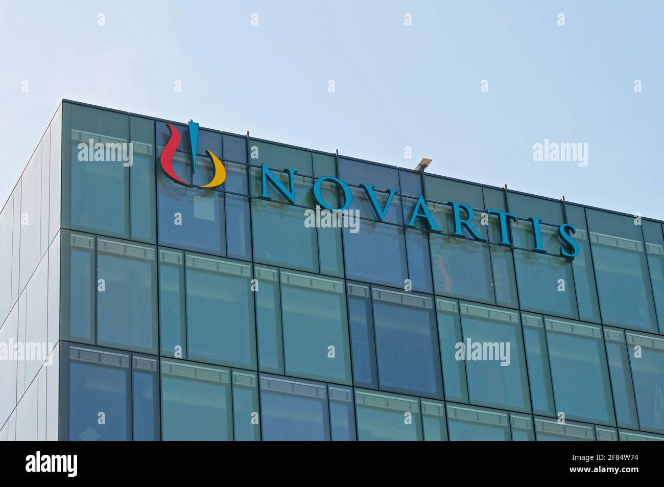 Rotkreuz, Zug, Switzerland - 28th March 2021 : Novartis sign hanging at the building in Rotkreuz, Switzerland. Novartis is one of the largest pharmace Stock Photo