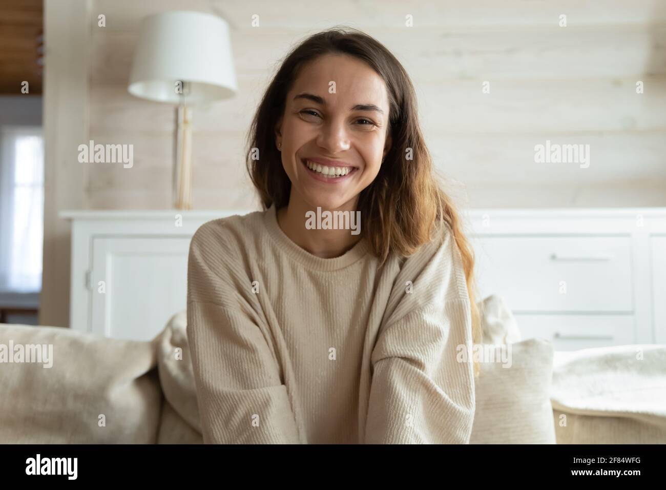 Screen view of smiling woman speak on video webcam call Stock Photo