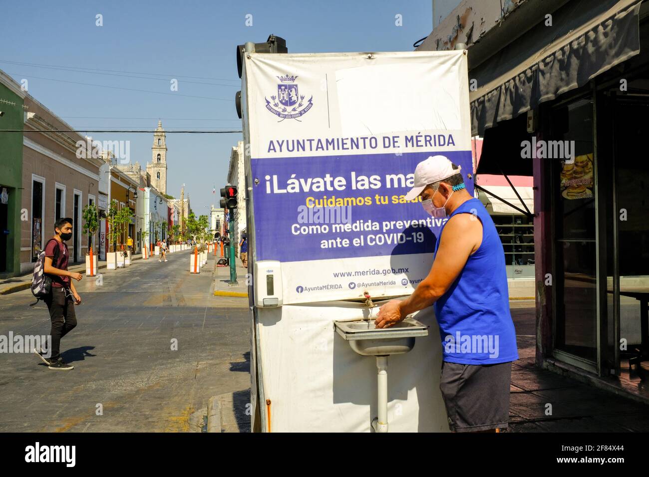 Man washing his hands in a Mobile handwashing station in Merida, Mexico/Washing hands is one of the most effective methods to combat the spread of Covid-19 Stock Photo