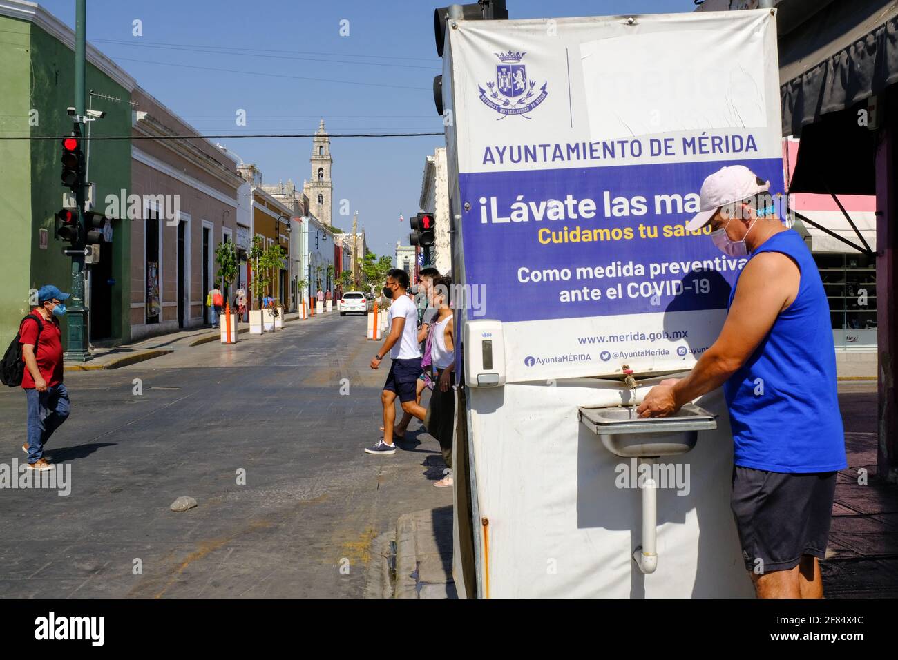 Man washing his hands in a Mobile hand washing station in Merida, Mexico/Washing hands is one of the most effective methods to combat the spread of Covid-19 Stock Photo