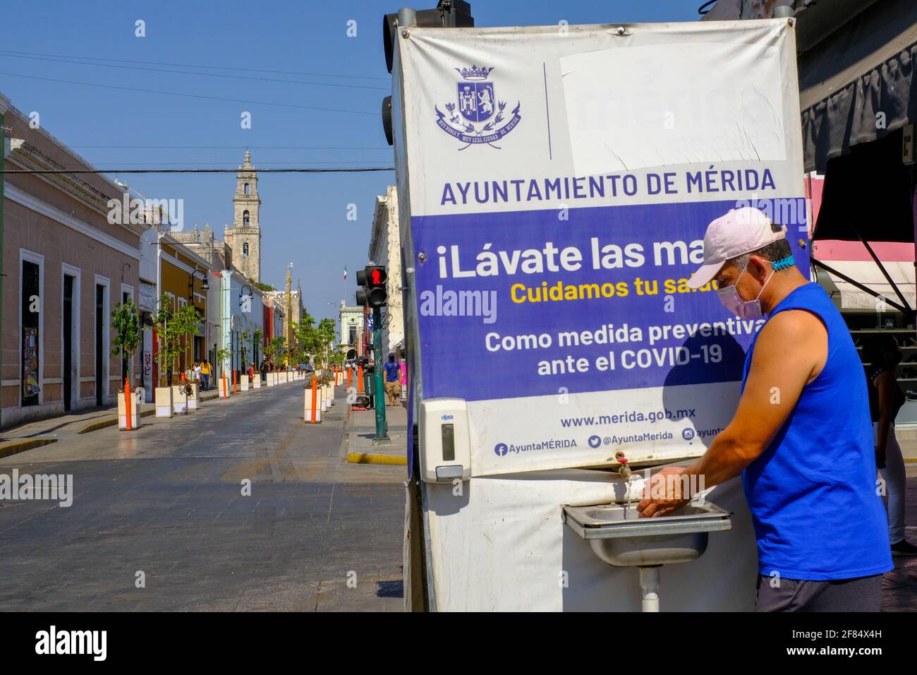 Man washing his hands in a Mobile hand washing station in Merida, Mexico/Washing hands is one of the most effective methods to combat the spread of Covid-19 Stock Photo