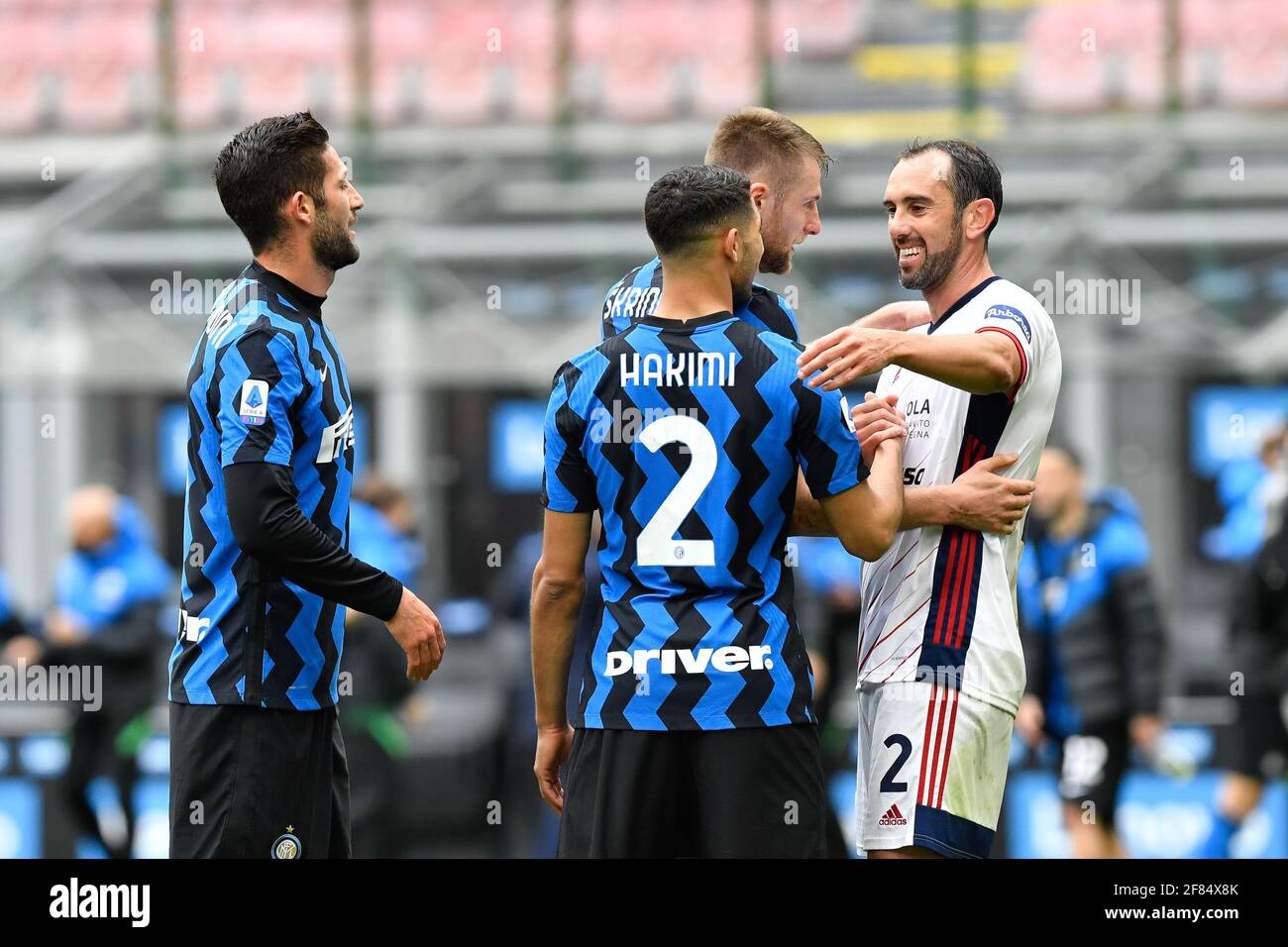Milan, Italy. 11th Apr, 2021. Diego Godin (2) of Cagliari Calcio greeting  his former teammates from Inter Milan after the Serie A match between Inter  Milan and Cagliari Calcio at the San, image size:1300x956