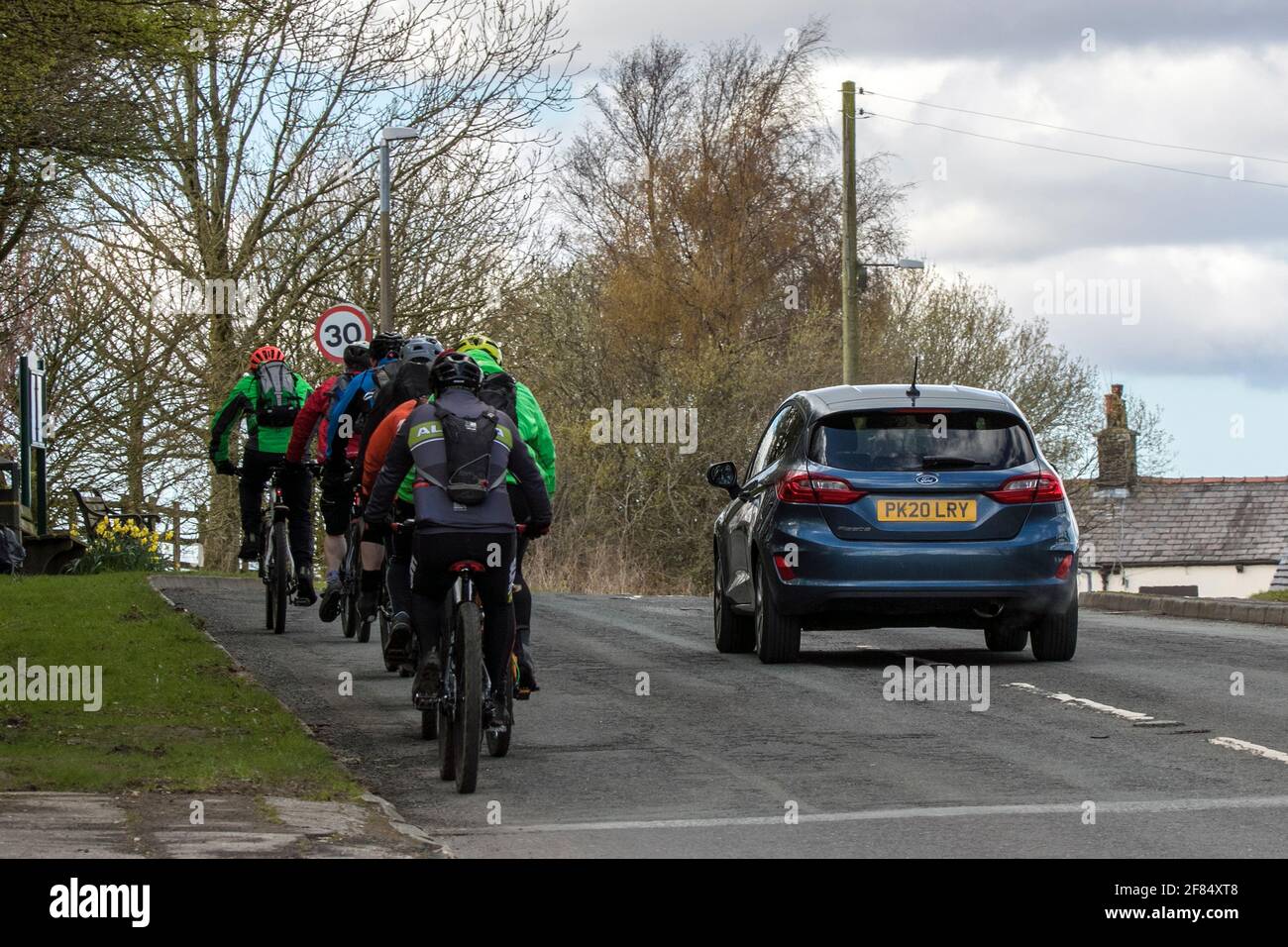 Cyclists traffic uk car overtaking hires stock photography and images Alamy
