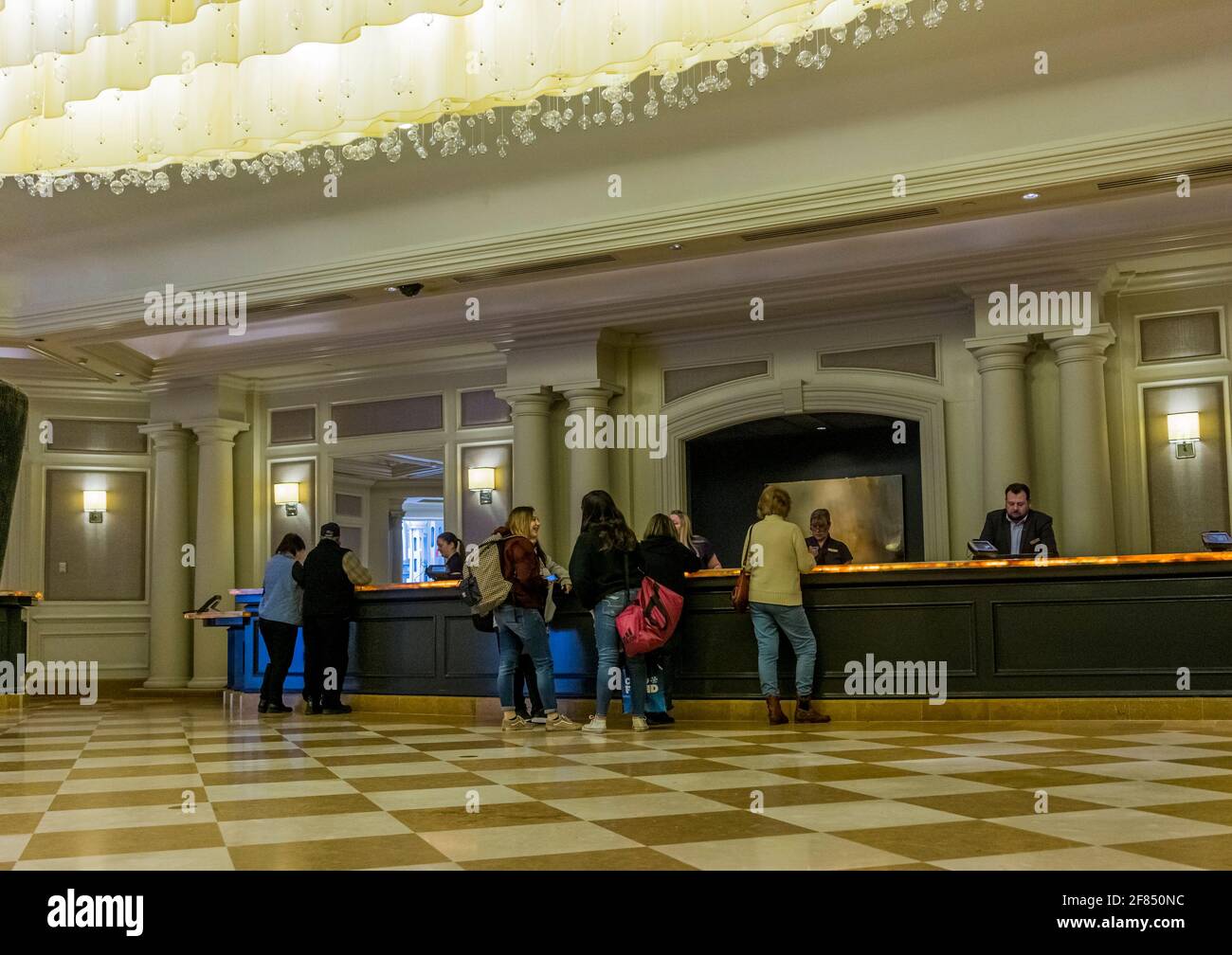 Niagara, Canada, March 2018 - Busy reception desk employees dealing with clients in the lobby of luxurious hotel of the Fallsview casino Stock Photo