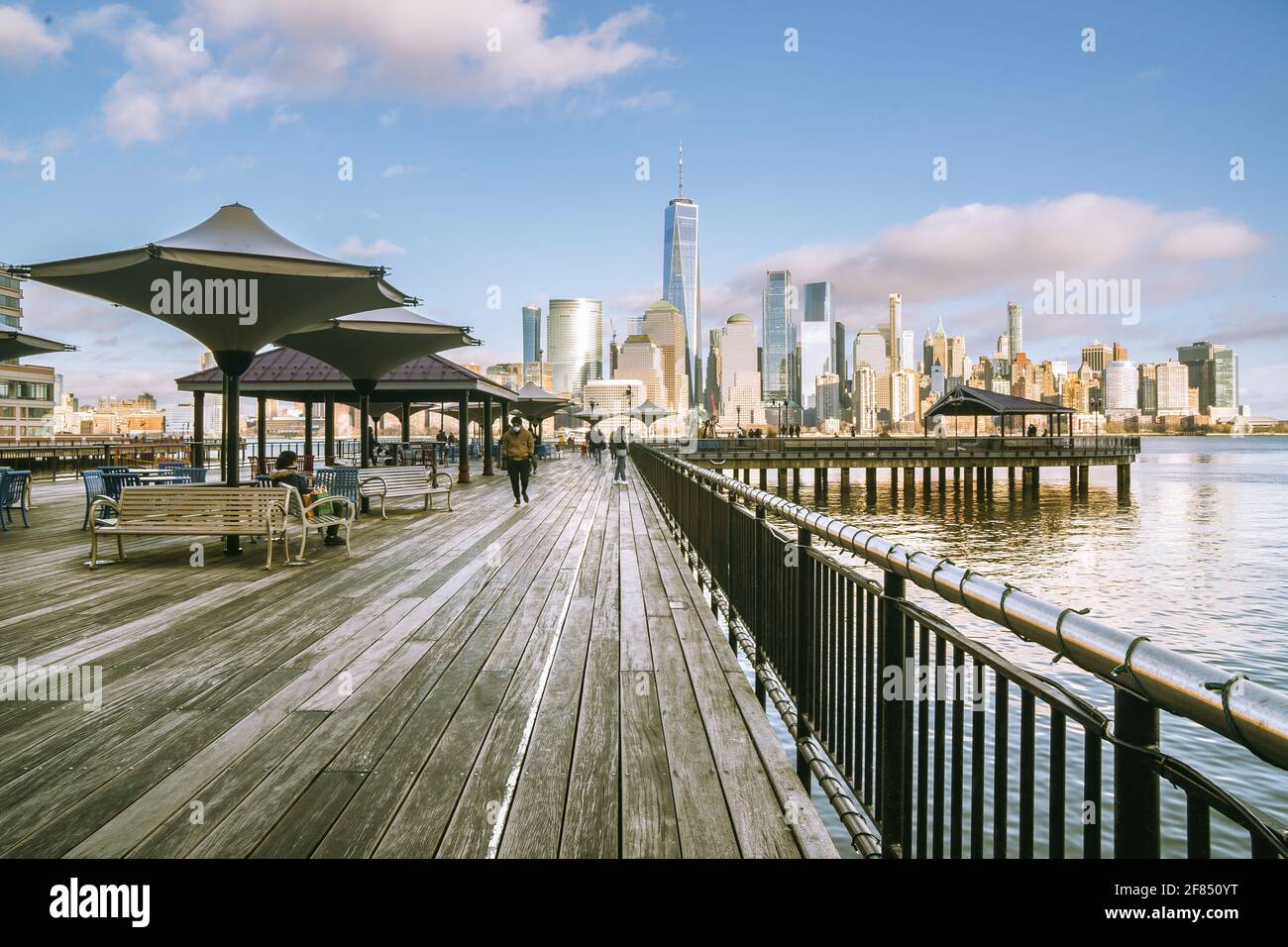 Jersey City, NJ USA Feb. 27, 2021 Landscape sunset view of people