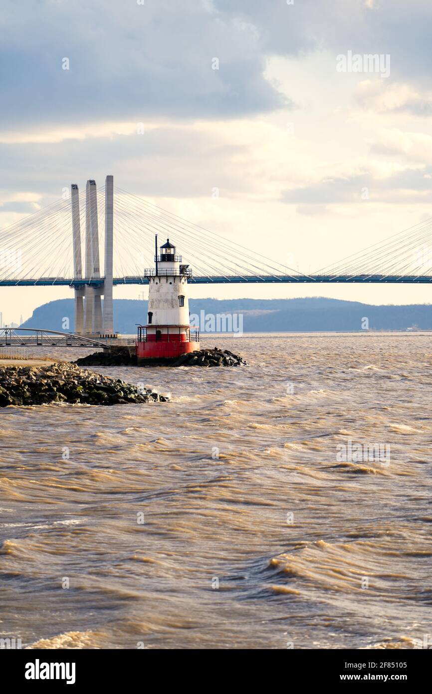 Tarrytown, NY - USA - Mar. 14, 2021: Vertical view of the Tarrytown Light, a sparkplug lighthouse on the east side of the Hudson River. Seen at sunset Stock Photo