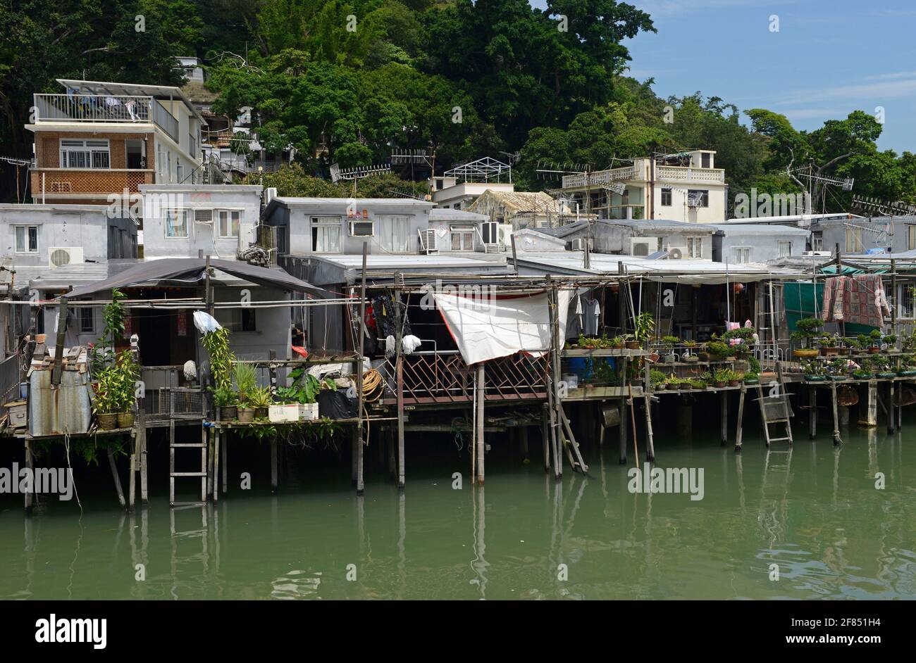 Many Tanka community stilt houses over the water in the coastal village