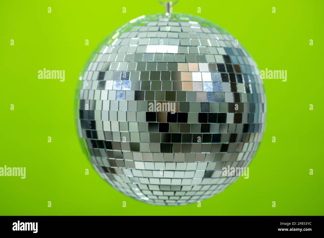 Shining Disco Ball dance music equipment isolated on green background
