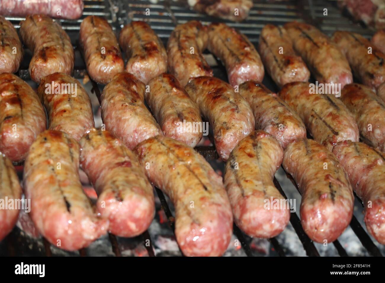 Mixed meat with ribs of beef and sausage on the grill Stock Photo