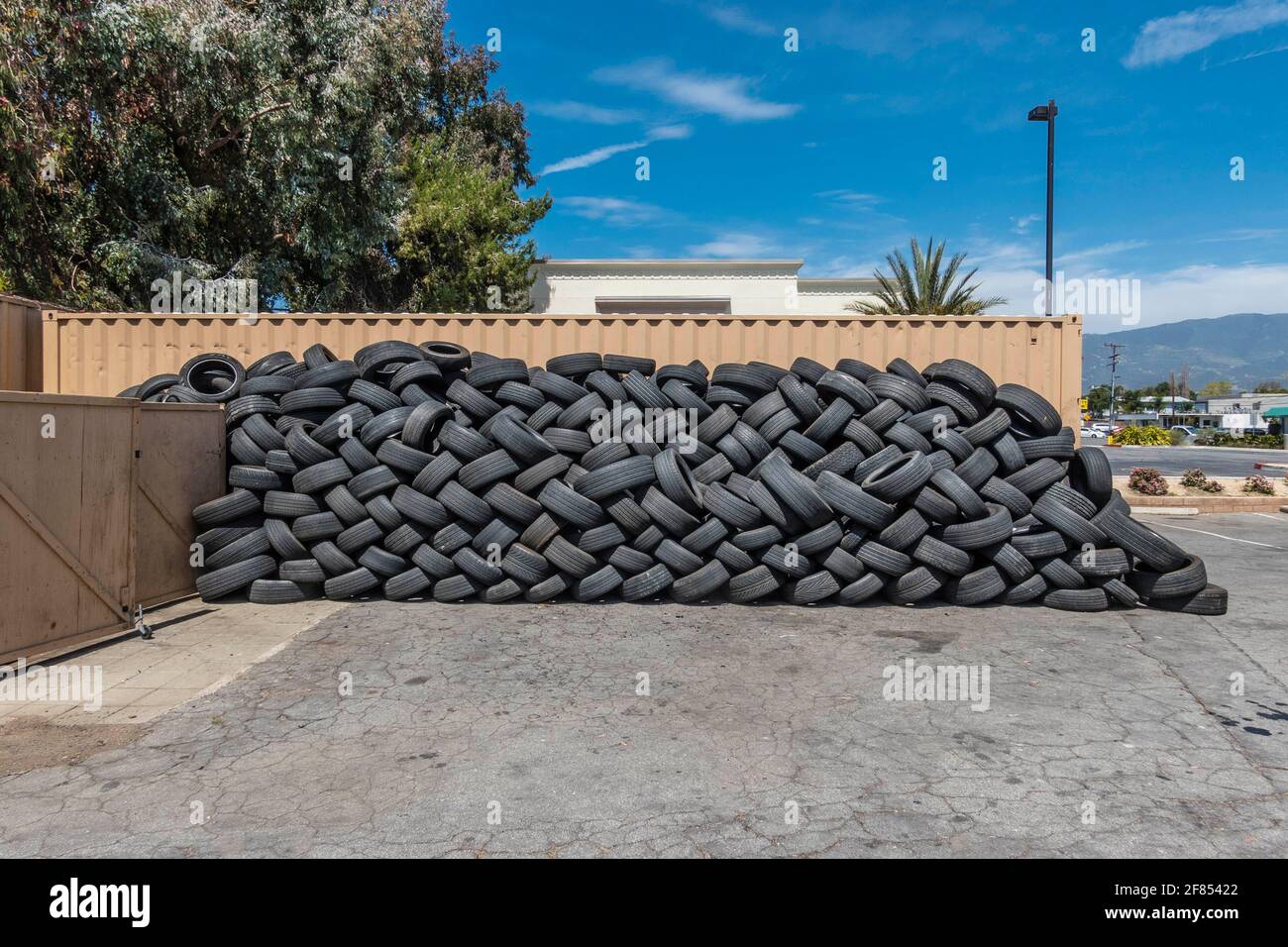 A lot of used tires stacked up outside a tire store Stock Photo Alamy