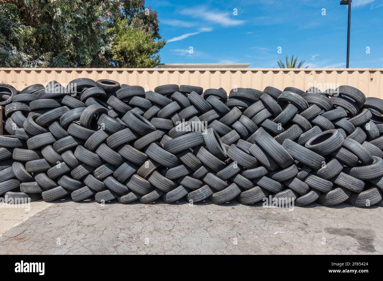 A lot of used tires stacked up outside a tire store Stock Photo Alamy