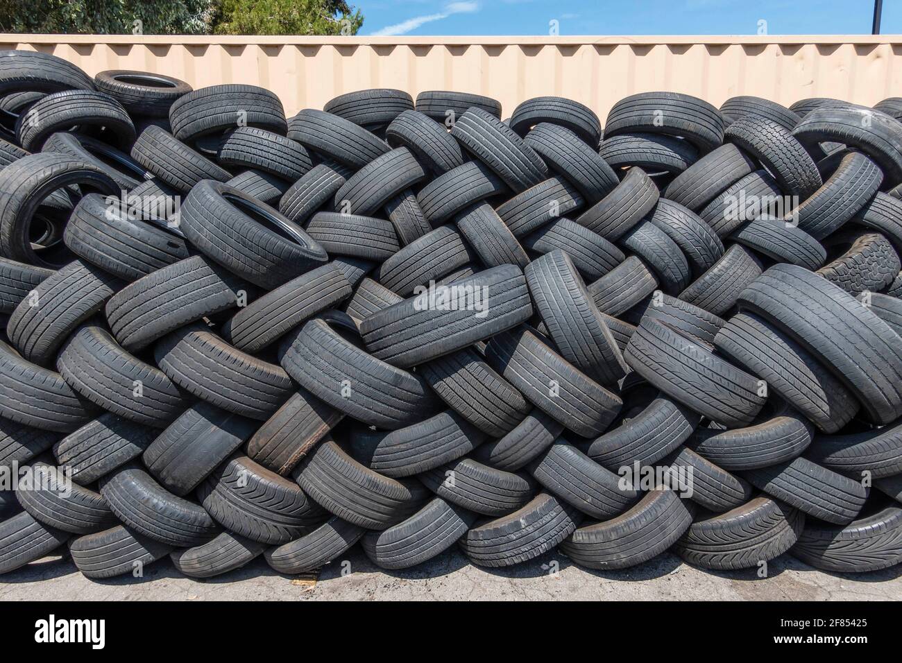 A lot of used tires stacked up outside a tire store Stock Photo Alamy
