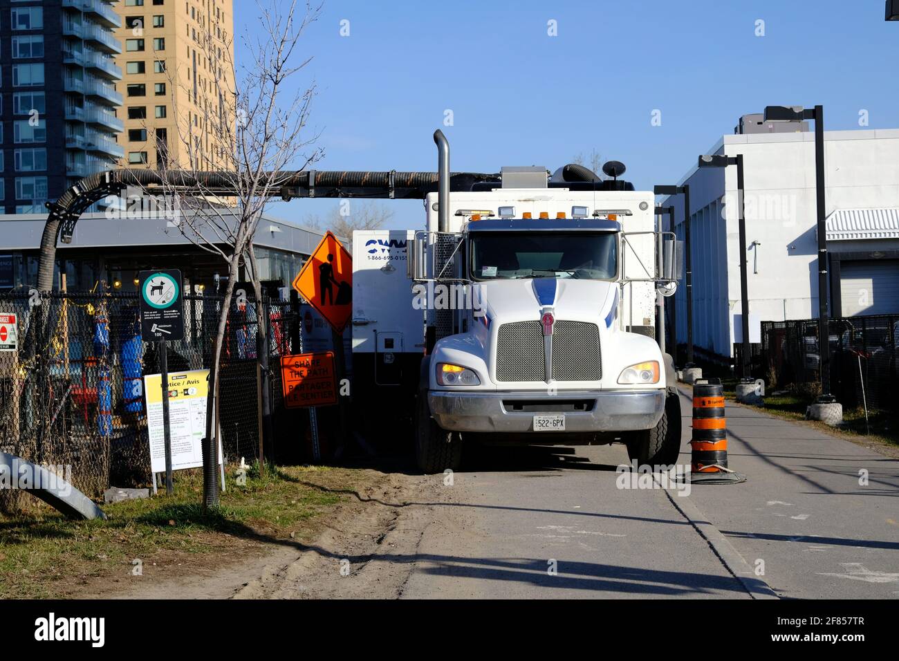 Clean Water Works truck providing sewer and infrastructure services as part of the Trillium Line O-Train South Extension, Ottawa, Ontario, Canada. Stock Photo