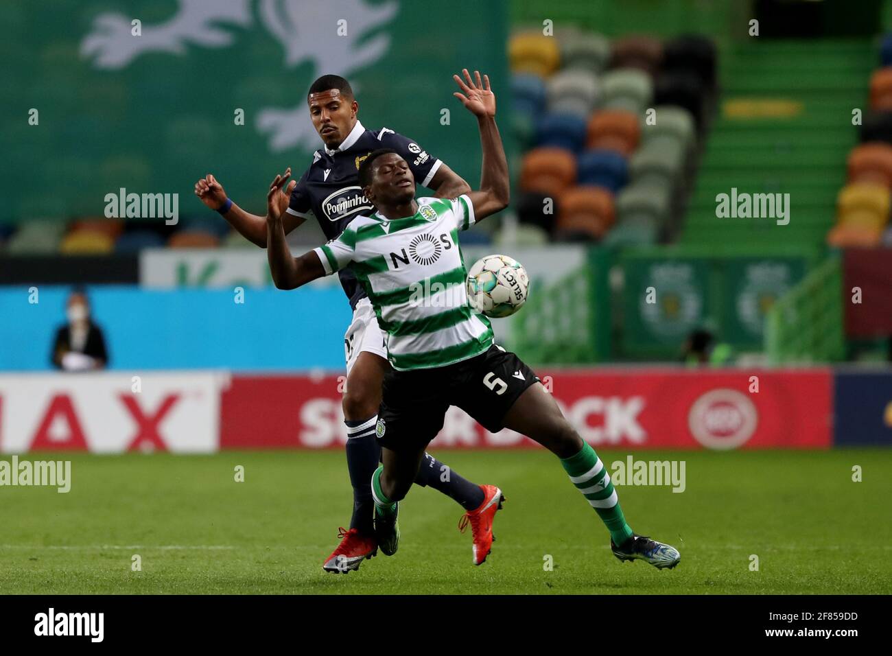 Lisbon Portugal 11th Apr 2021 Nuno Mendes Of Sporting Cp R Vies With Anderson Oliveira Of Fc Famalicao During The Portuguese League Football Match Between Sporting Cp And Fc Famalicao At