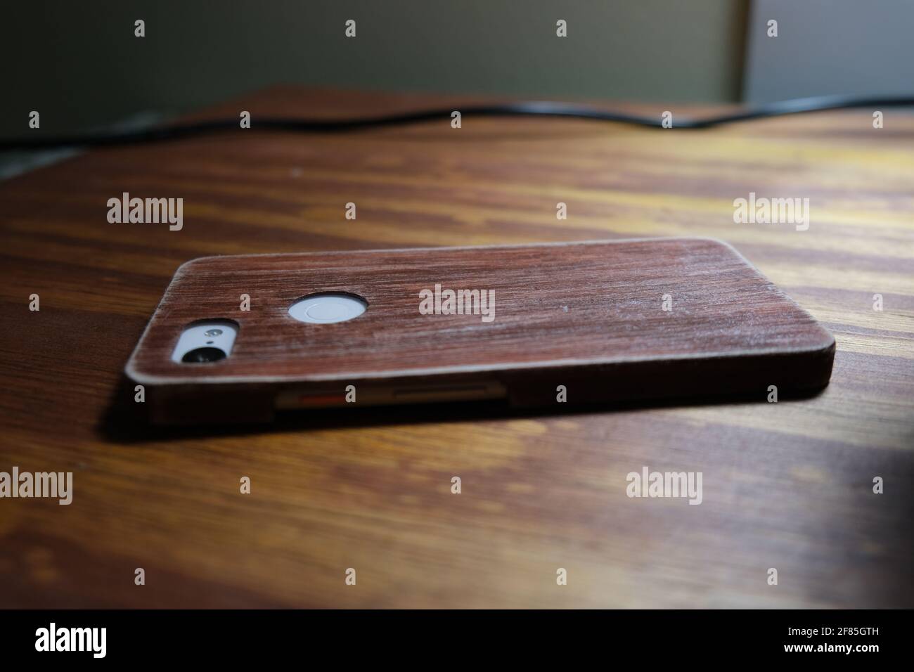 Wood 3D Printed Phone Case on wooden table Stock Photo