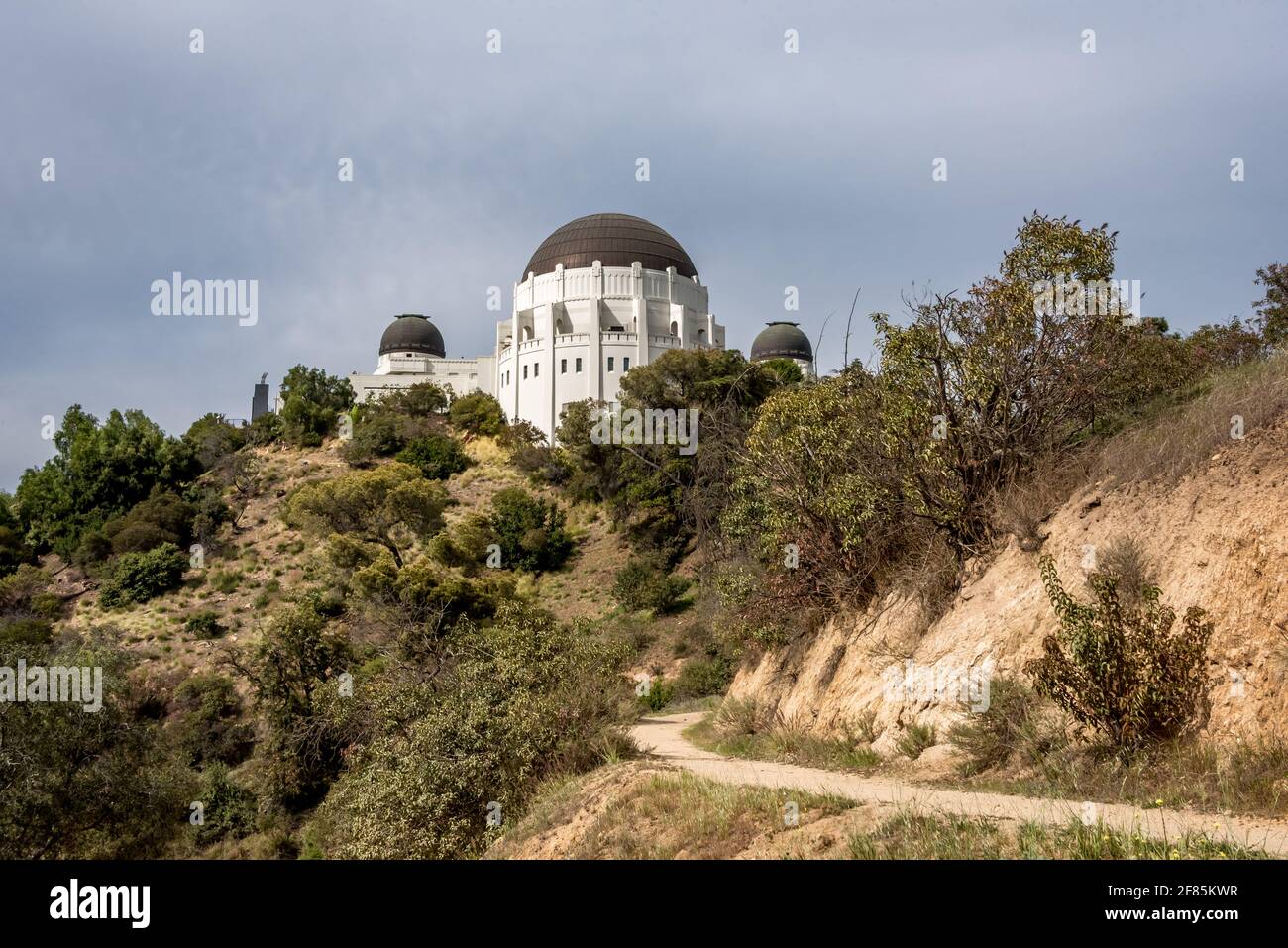 Looking up at Griffith Observatory from east hiking trail in Griffith Park, a popular loop for exercise with social distancing in Los Angeles Stock Photo
