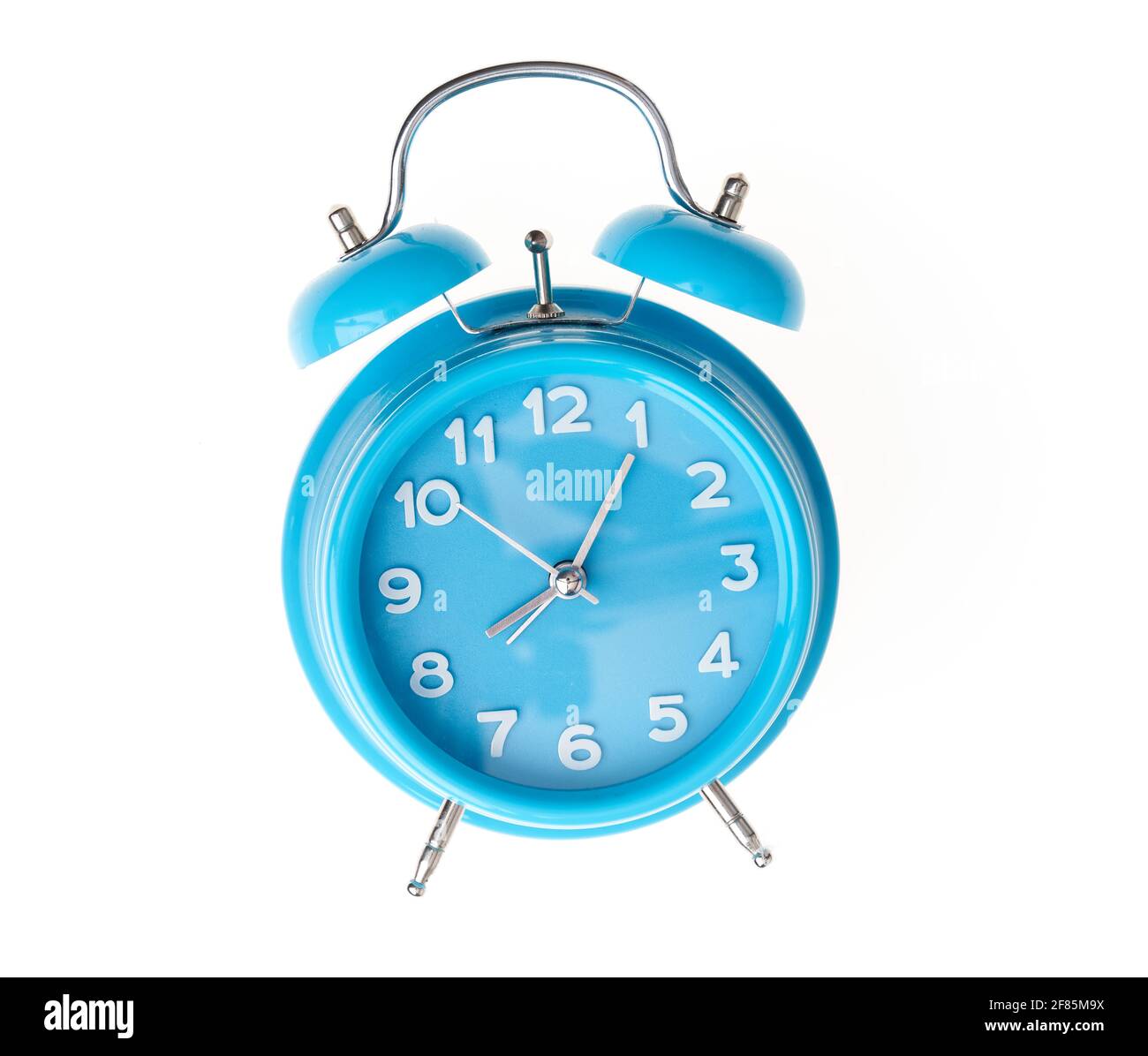 Hand of hispanic man holding blue alarm clock over isolated white background. Stock Photo