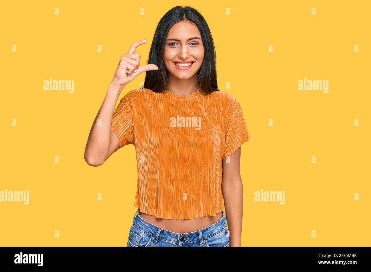 Young brunette arab woman wearing casual clothes smiling and confident ...