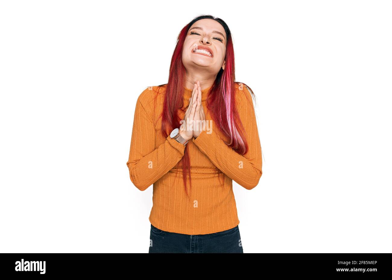 Young caucasian woman wearing casual clothes begging and praying with ...