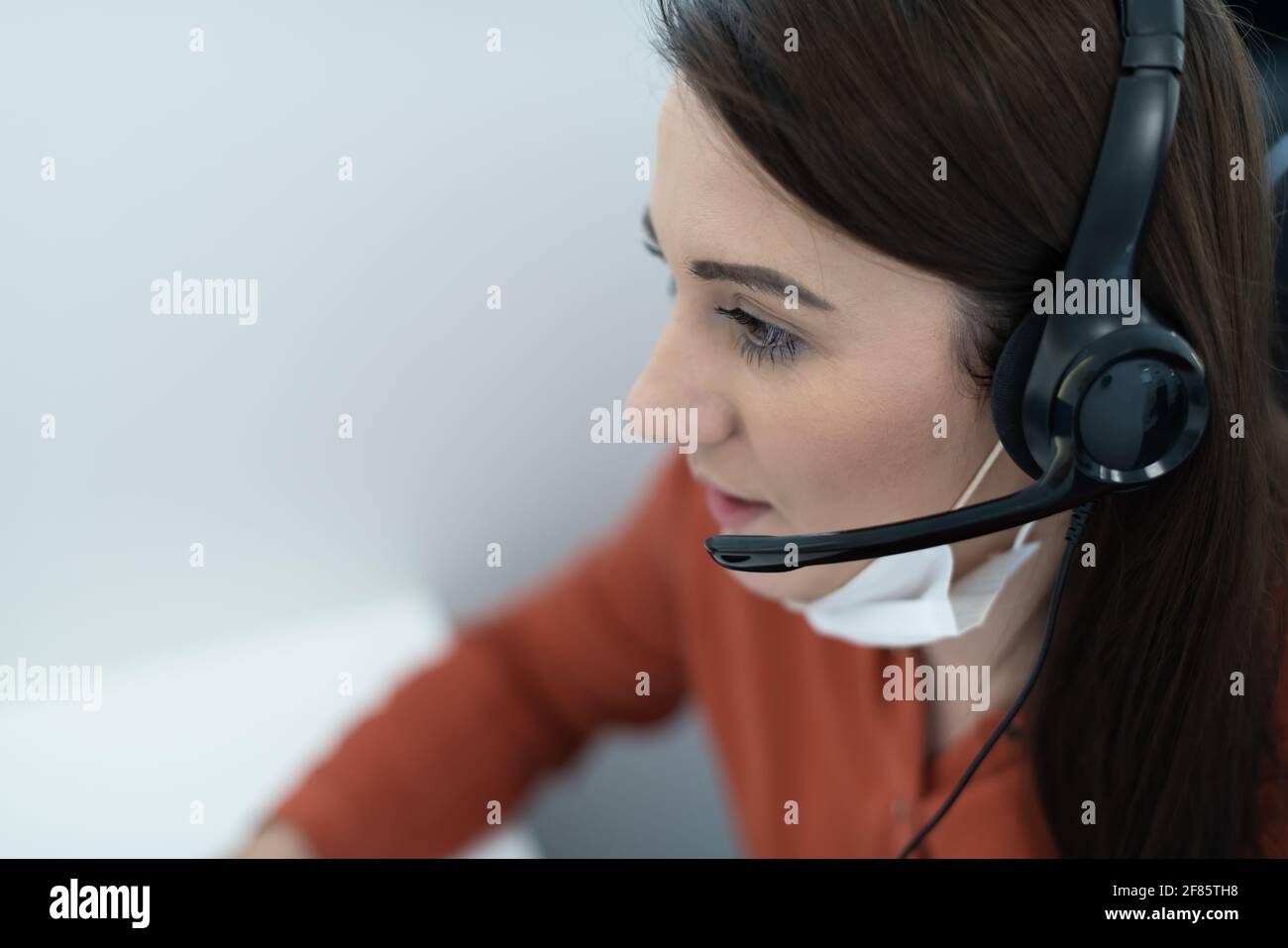 call center operator in medical mask Stock Photo