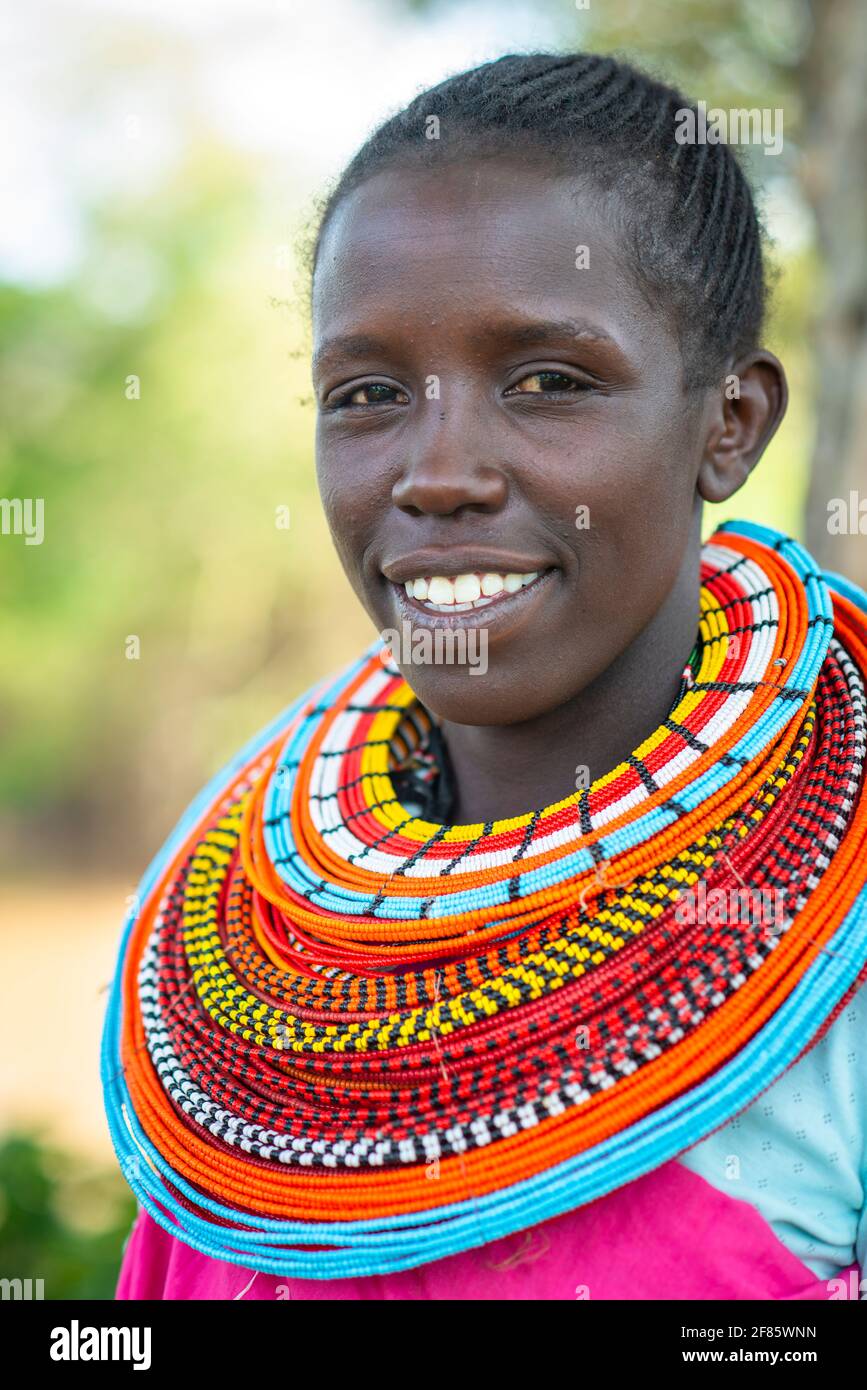 traditional African Maasai woman wearing beaded necklace and colorful shuka cloth Stock Photo