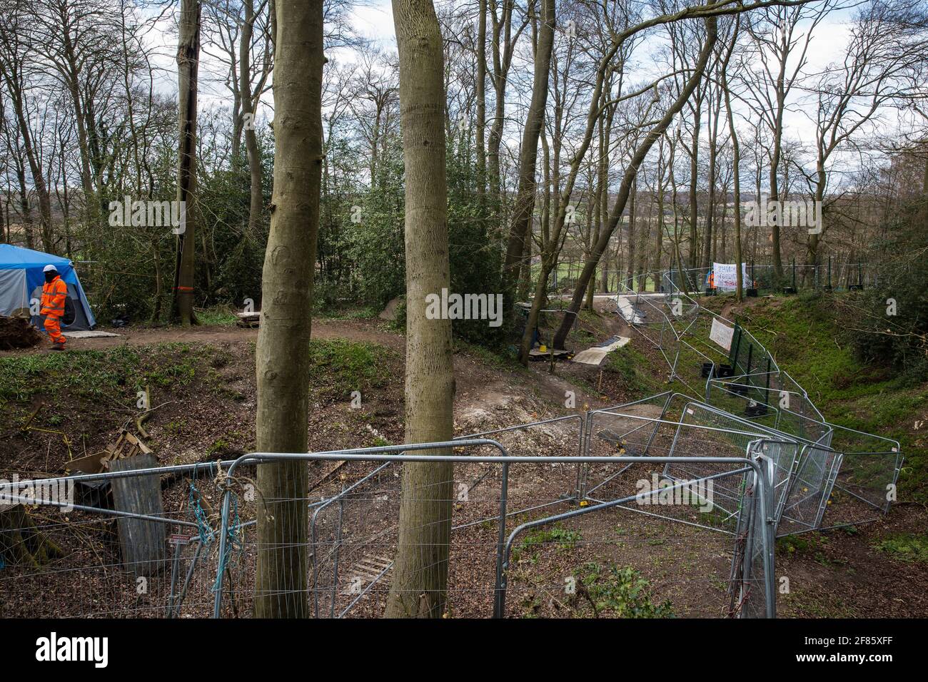 Wendover, UK. 9th April, 2021. Fencing is used to divide two areas of Jones Hill Wood, ancient woodland said to have inspired Roald Dahl, during tree felling operations for the HS2 high-speed rail link. Tree felling work began this week, in spite of the presence of resting places and/or breeding sites for pipistrelle, barbastelle, noctule, brown long-eared and natterer's bats, following the issuing of a bat licence to HS2's contractors by Natural England on 30th March. Credit: Mark Kerrison/Alamy Live News Stock Photo