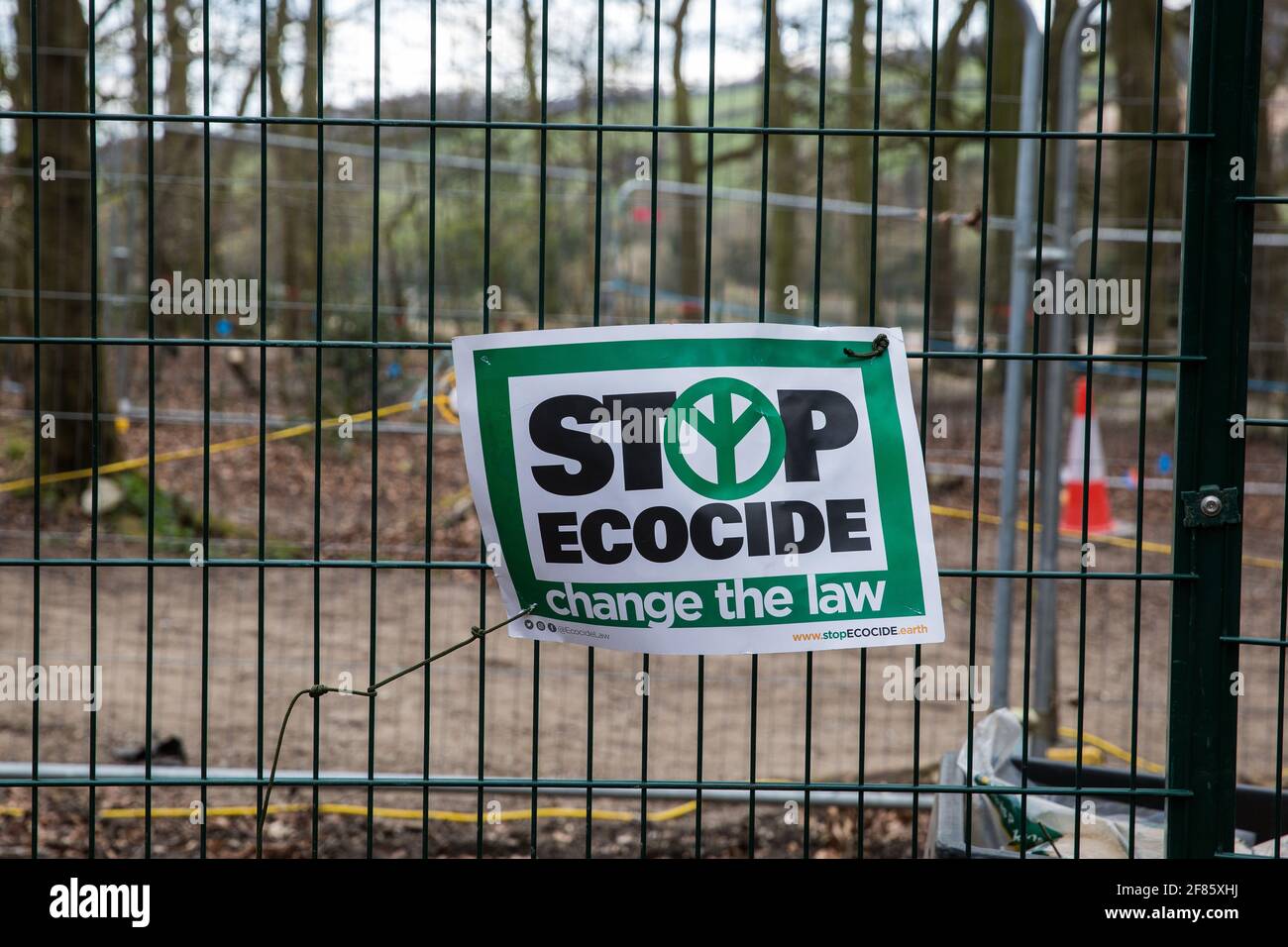Wendover, UK. 9th April, 2021. A sign reading ÔStop Ecocide: change the lawÕ is pictured in Jones Hill Wood, ancient woodland said to have inspired Roald Dahl, during tree felling operations for the HS2 high-speed rail link. Tree felling work began this week, in spite of the presence of resting places and/or breeding sites for pipistrelle, barbastelle, noctule, brown long-eared and natterer's bats, following the issuing of a bat licence to HS2's contractors by Natural England on 30th March. Credit: Mark Kerrison/Alamy Live News Stock Photo