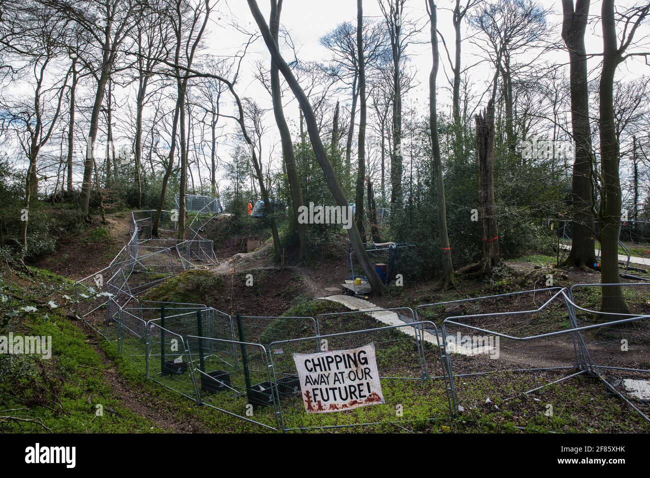 Wendover, UK. 9th April, 2021. Fencing is used to divide two areas of Jones Hill Wood, ancient woodland said to have inspired Roald Dahl, during tree felling operations for the HS2 high-speed rail link. Tree felling work began this week, in spite of the presence of resting places and/or breeding sites for pipistrelle, barbastelle, noctule, brown long-eared and natterer's bats, following the issuing of a bat licence to HS2's contractors by Natural England on 30th March. Credit: Mark Kerrison/Alamy Live News Stock Photo