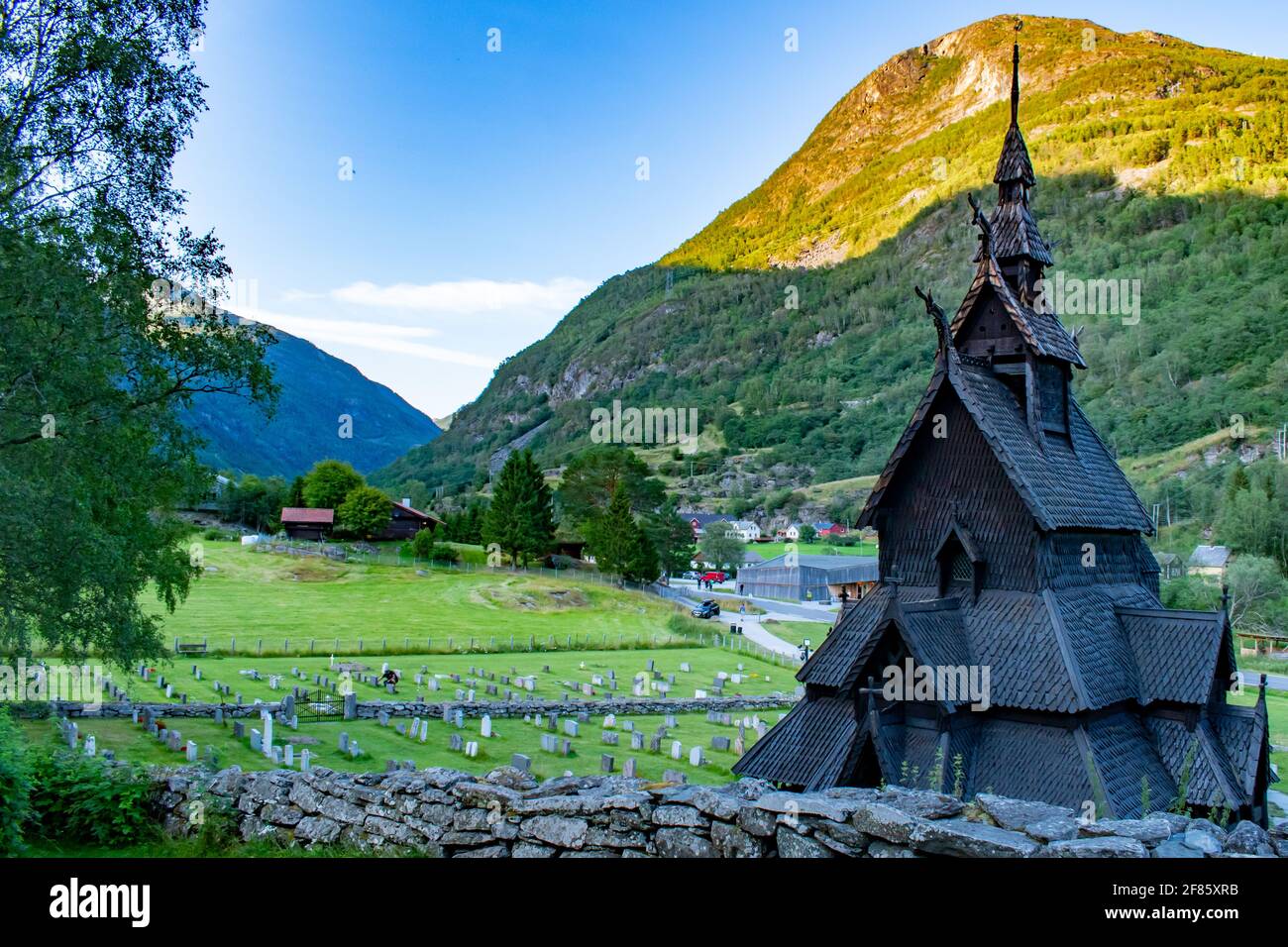 Borgund stave church in Norway, medieval wooden Christian Church with beautiful valley behind Stock Photo