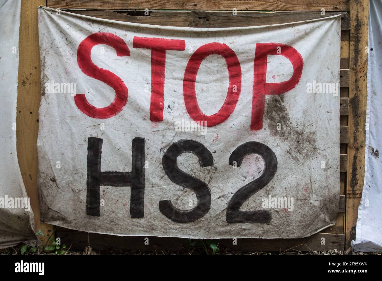 Wendover, UK. 9th April, 2021. A Stop HS2 banner hangs from the exterior of Wendover Active Resistance Camp, which is occupied by activists opposed to the HS2 high-speed rail link. Tree felling work for the project is now taking place at several locations between Great Missenden and Wendover in the Chilterns AONB, including opposite the camp. Credit: Mark Kerrison/Alamy Live News Stock Photo