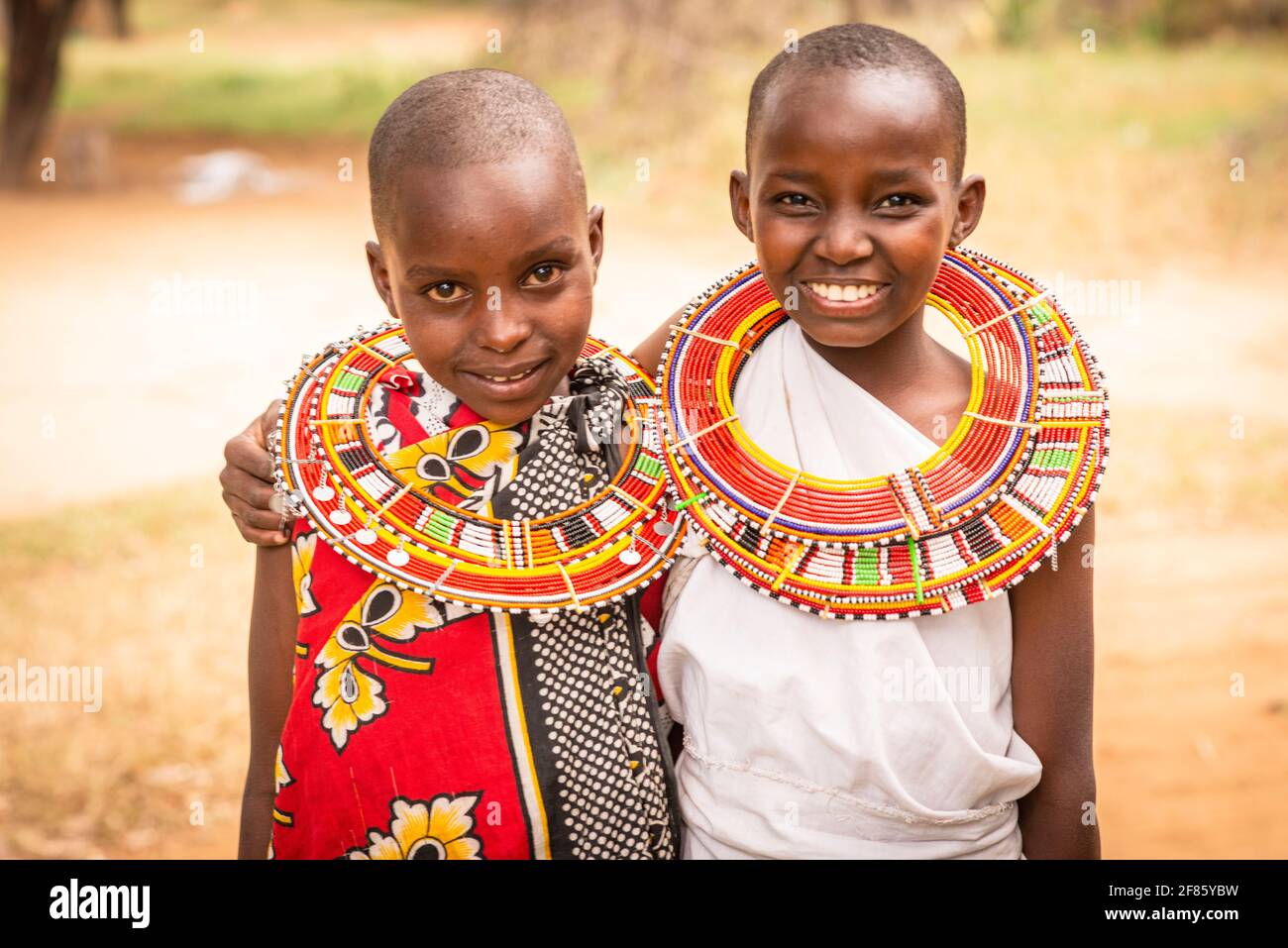 Maasai girl friends in Maasai clothes Stock Photo