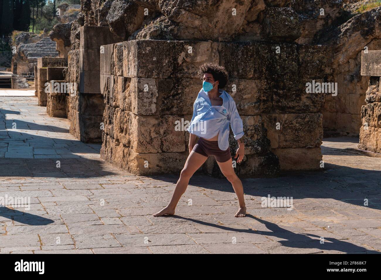 Stretching man wearing mask hi-res stock photography and images - Alamy