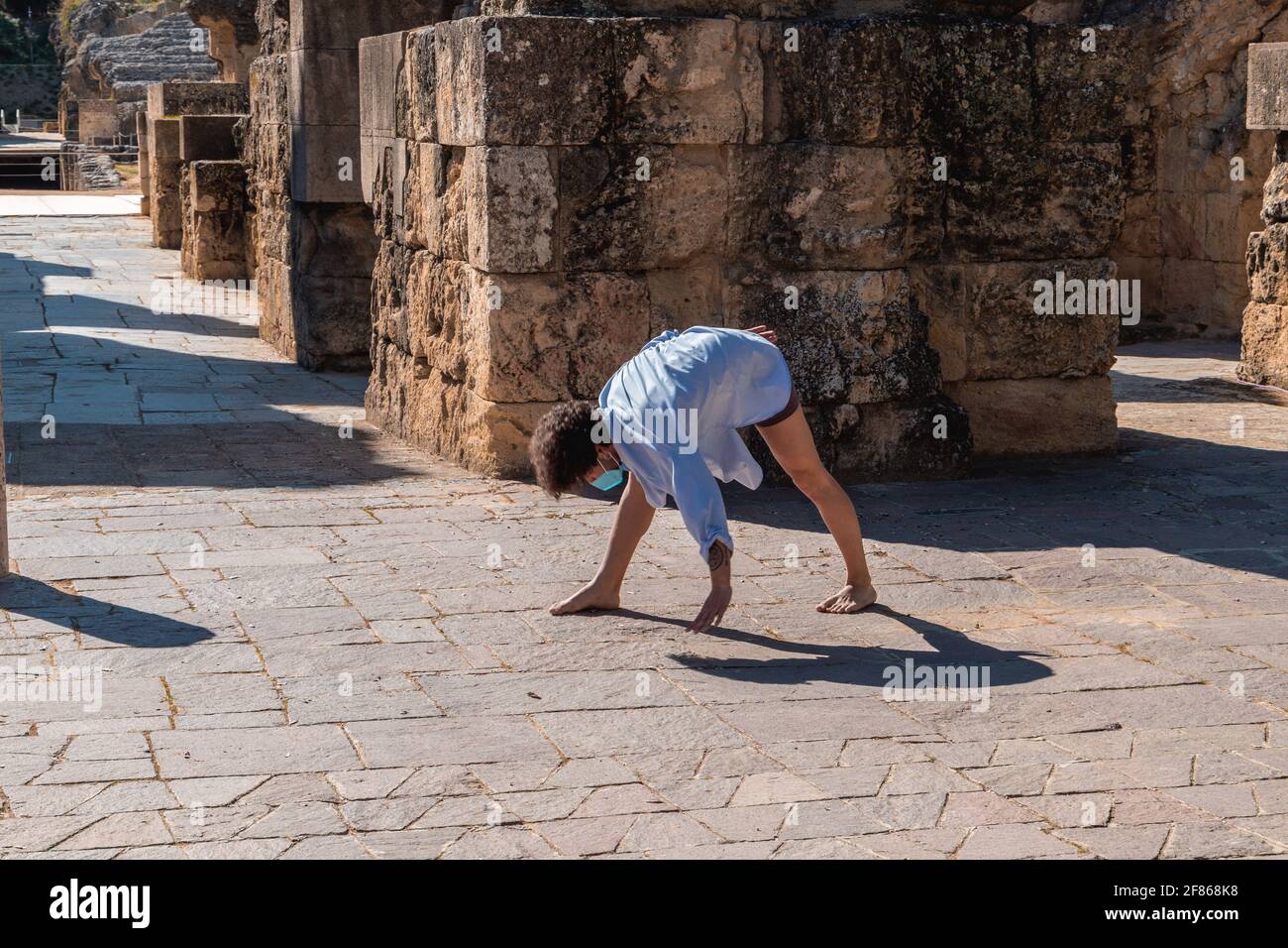 Stretching man wearing mask hi-res stock photography and images - Alamy