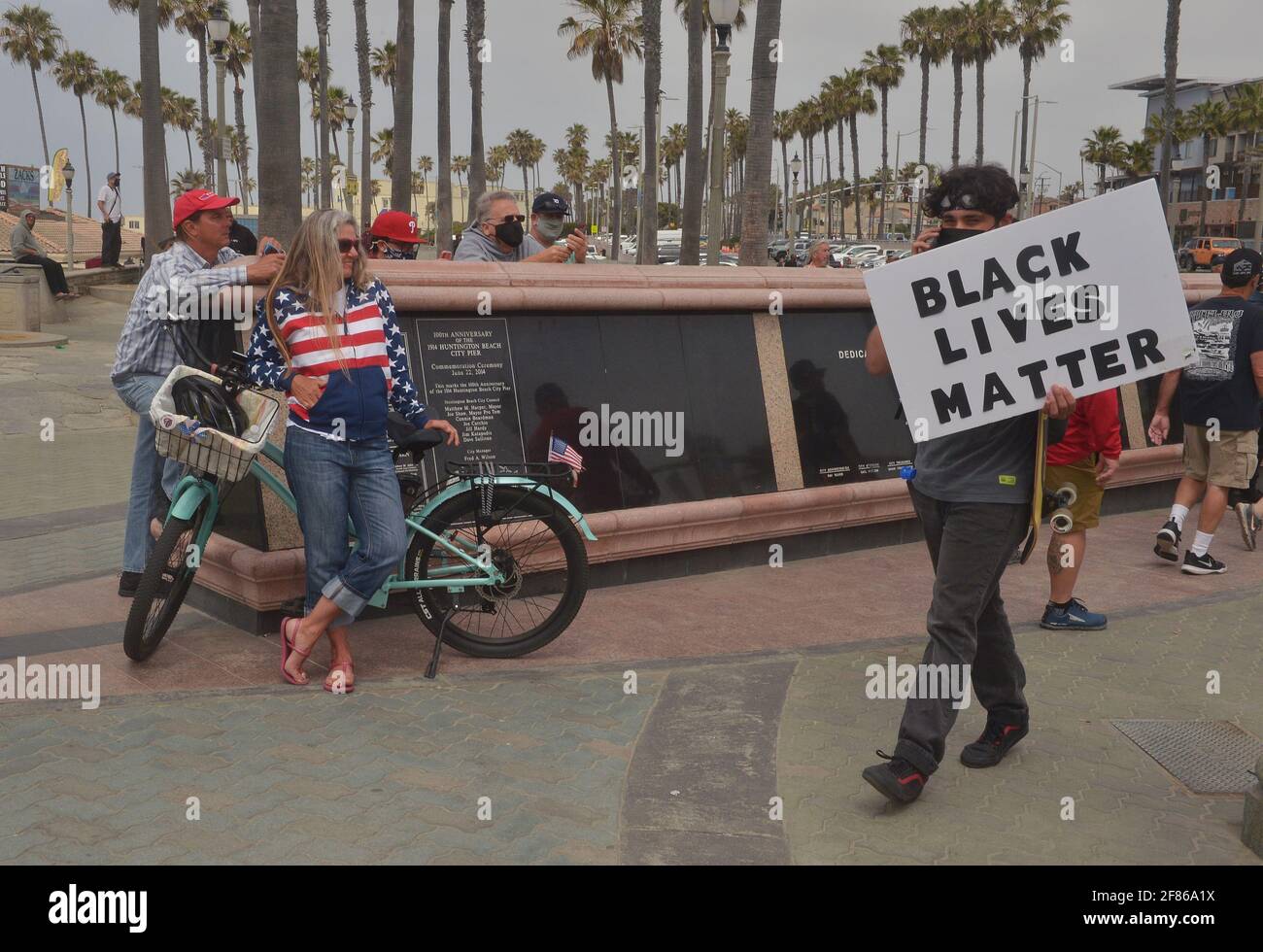 Outnumbered White Lives Matter and counter Black Lives Matter demonstrators face off in Huntington Beach, California on Sunday, April 11, 2021. The BLM protesters occupied Pier Plaza to prevent any demonstrators by the WLM group. The WLM rally was part of a nationwide group of protests planned in a handful of cities across the country to combat what organizers see as the threat to the white race from multiculturalism and what they term as the 'anti-white' bias in media, government and education. Photo by Jim Ruymen/UPI Stock Photo
