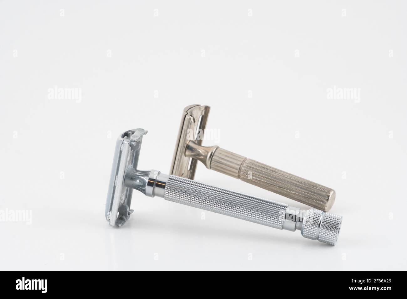 Vintage double edge safety razor for shaving, metal, nickle, and chrome. On white isolated background Stock Photo