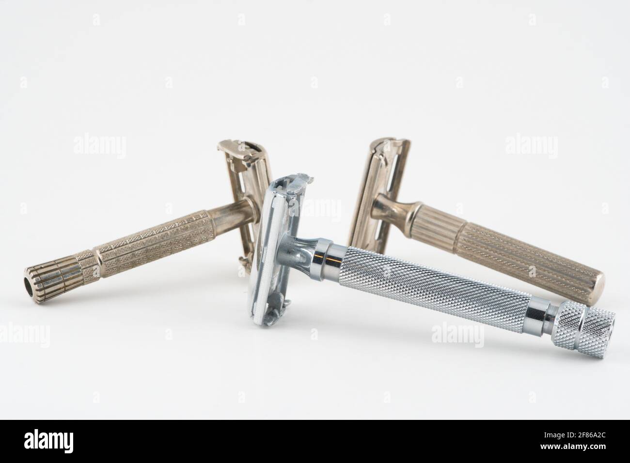 Vintage double edge safety razor for shaving, metal, nickle, and chrome. On white isolated background Stock Photo