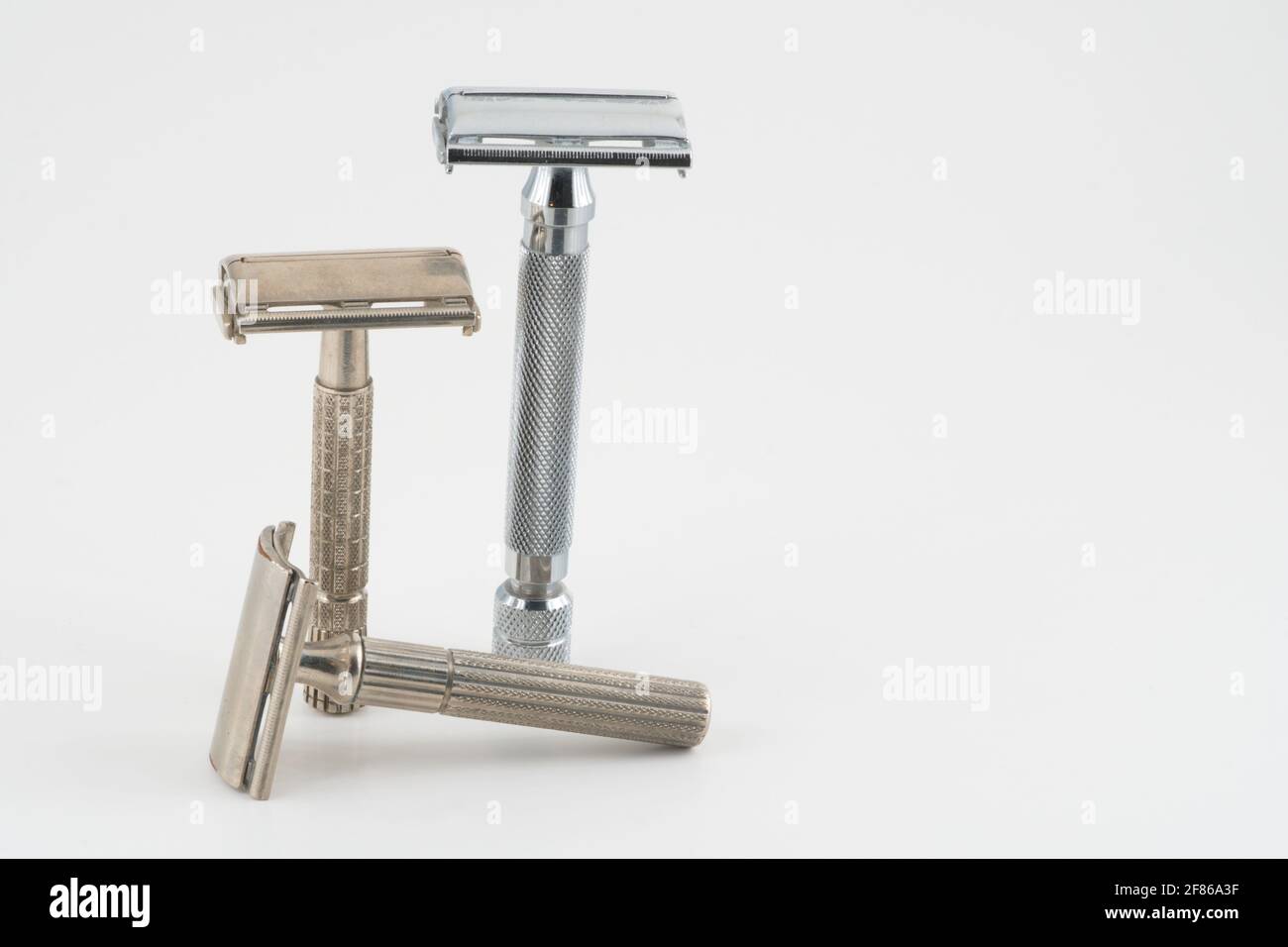 Vintage double edge safety razor for shaving, metal, nickle, and chrome. On white isolated background Stock Photo