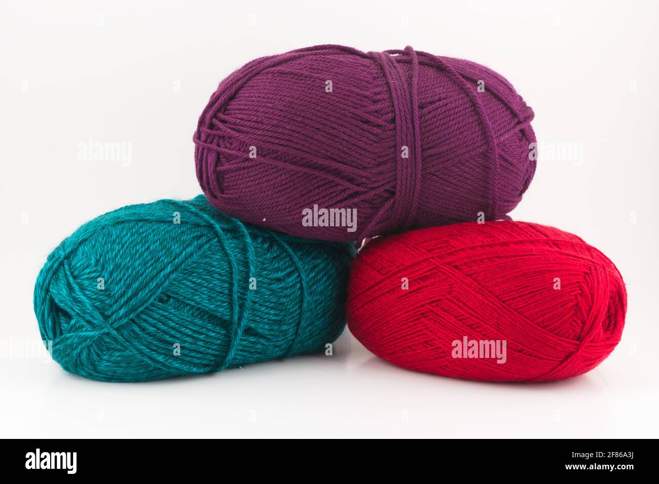 Three yarn balls / skeins isolated on a white background Stock Photo