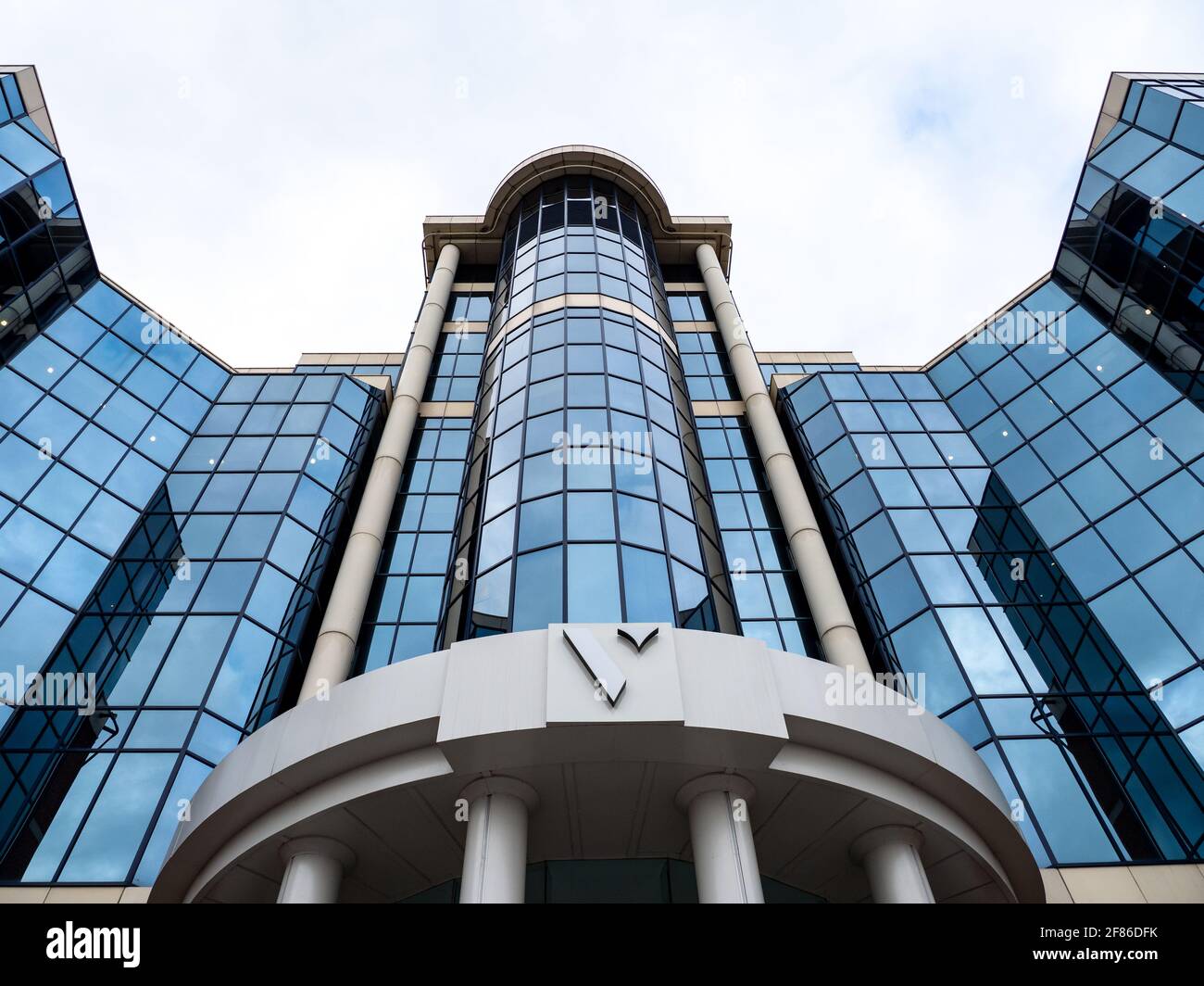 MANCHESTER, UNITED KINGDOM - Mar 28, 2021: modern office building in the city reinfections in the glass Stock Photo