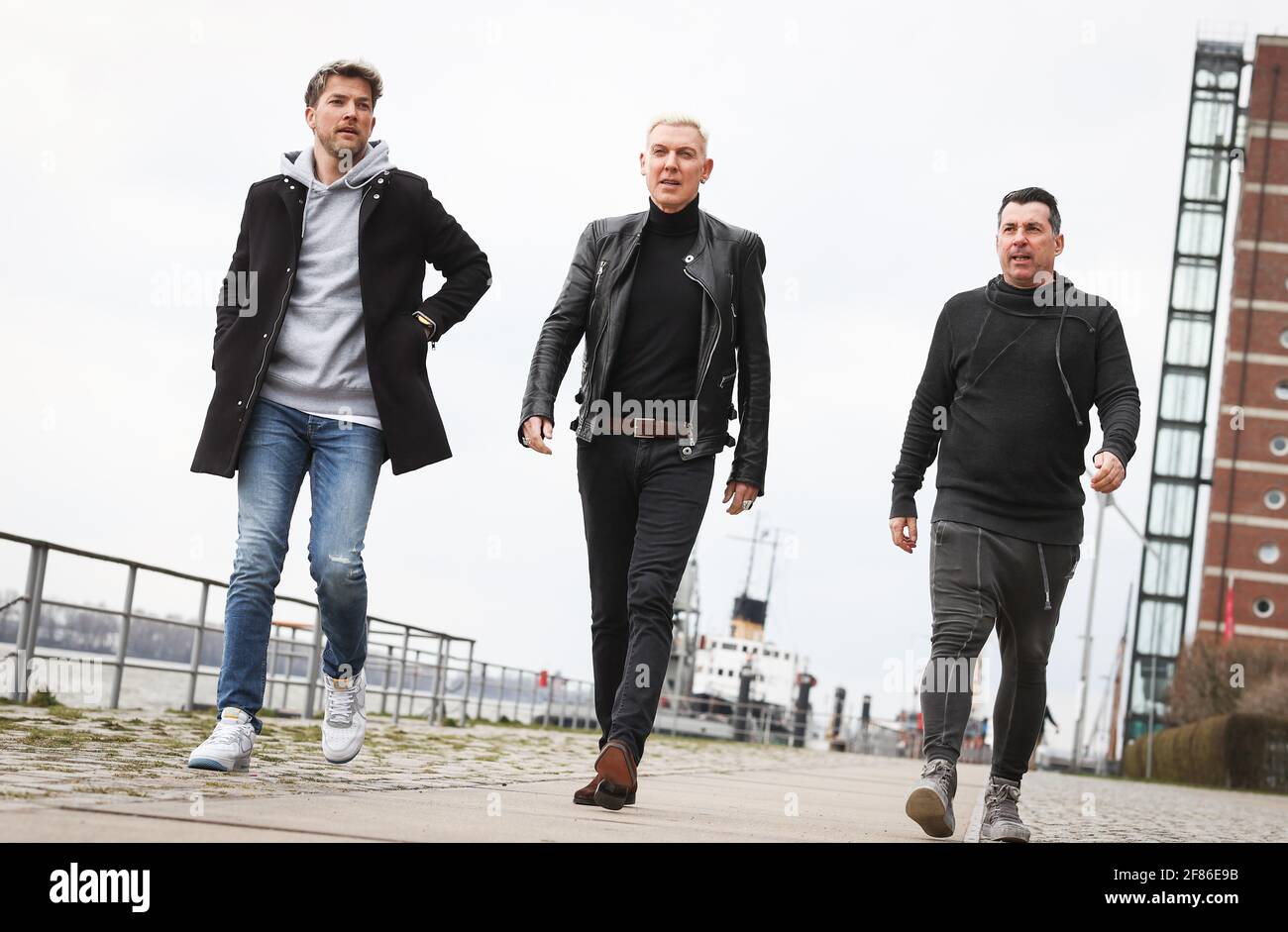 Hamburg, Germany. 09th Apr, 2021. H.P. Baxxter (M), frontman and singer of  the band Scooter, and his band members Sebastian Schilde (l) and Michael  Simon at a photo session after an interview