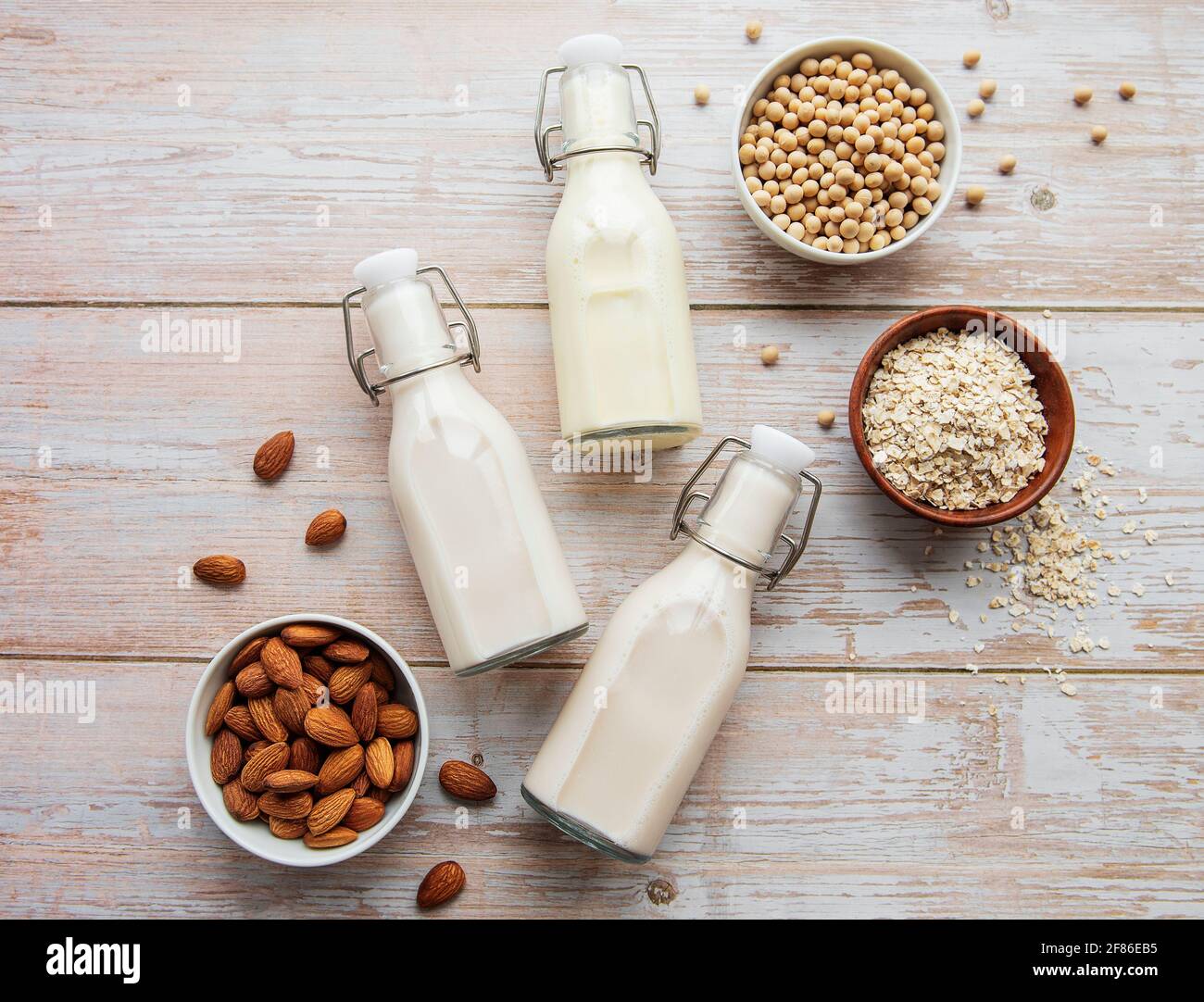 Bottles with different plant milk soy, almond and oat milk Stock