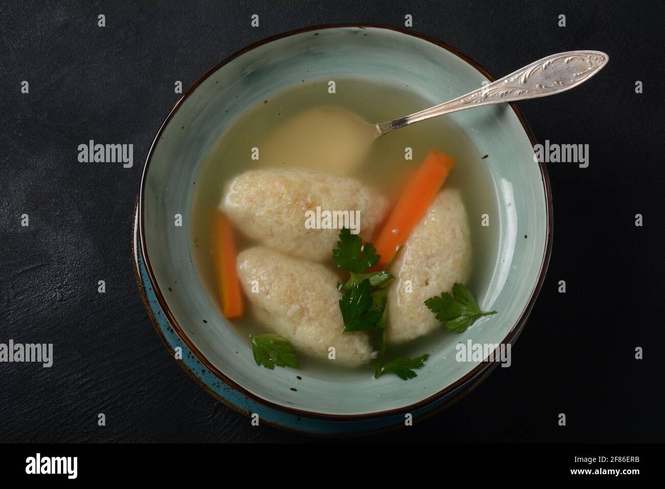 Griessnockerlsuppe. Clear Soup with Semolina Dumplings in a bowl