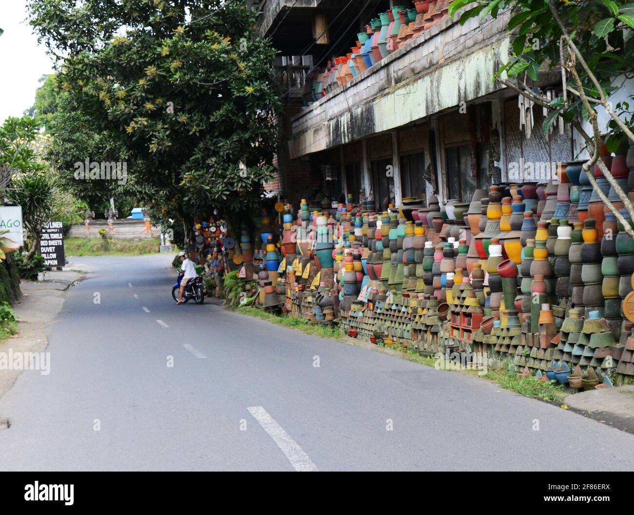 Roadside display of colourful pottery craftsmanship in Ubud, Bali. Stock Photo