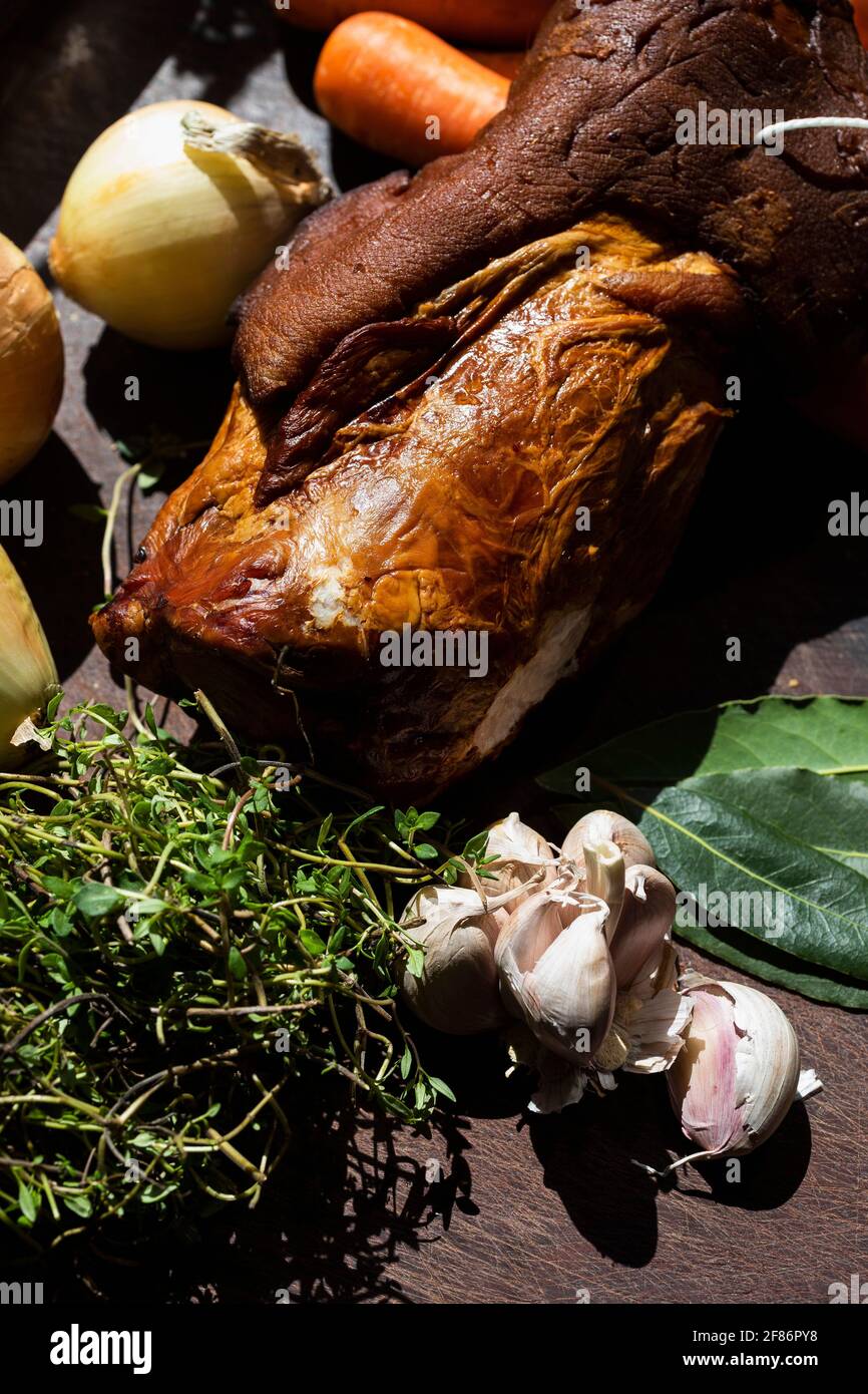 Still life fresh roasted suckling pig and ingredients Stock Photo