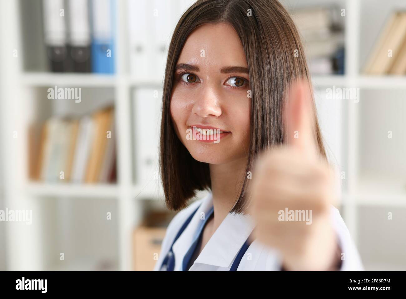 Female doctor thumb up sign hi-res stock photography and images - Alamy