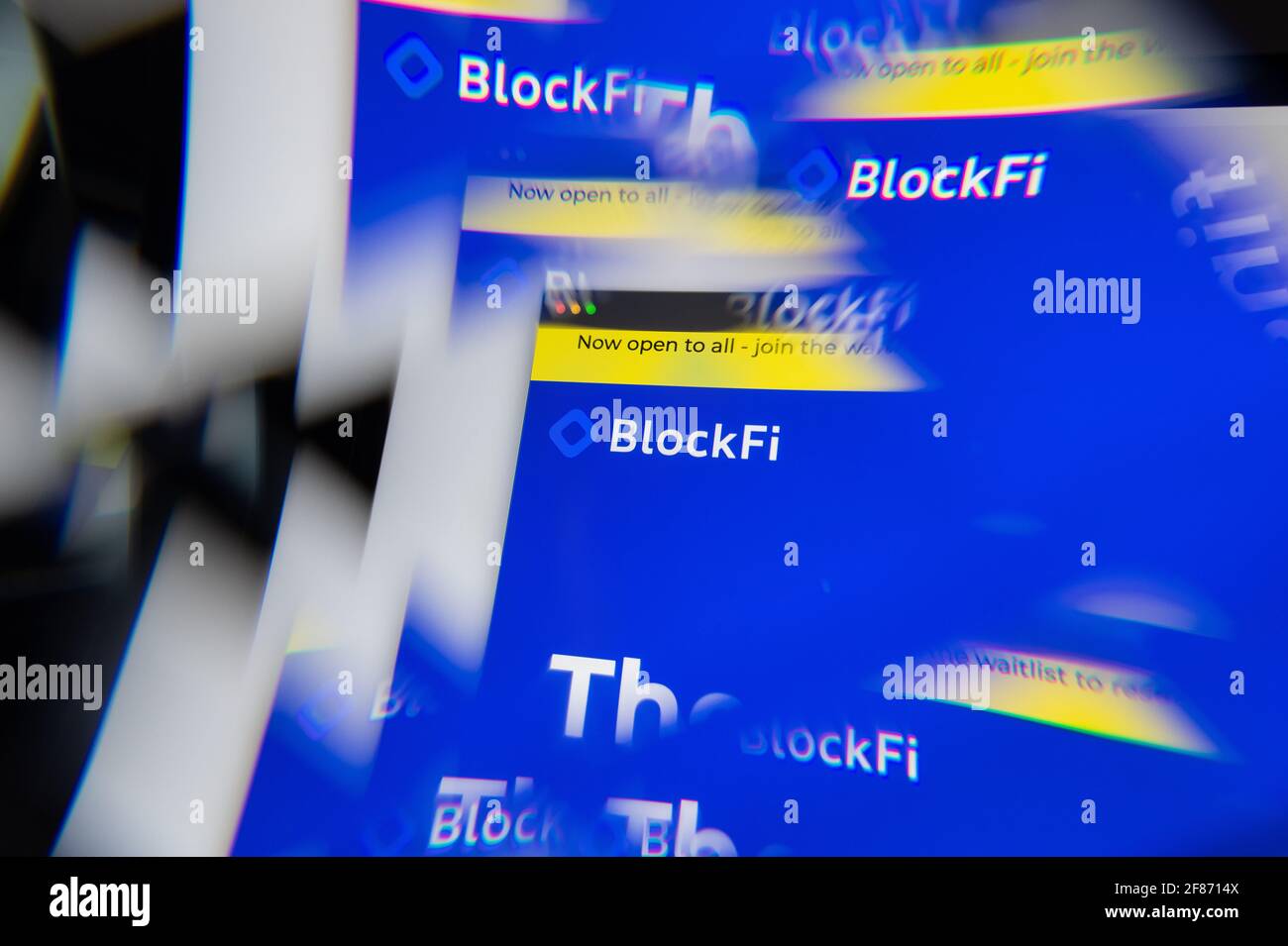 Milan, Italy - APRIL 10, 2021: BlockFi logo on laptop screen seen through an optical prism. Illustrative editorial image from BlockFi website. Stock Photo