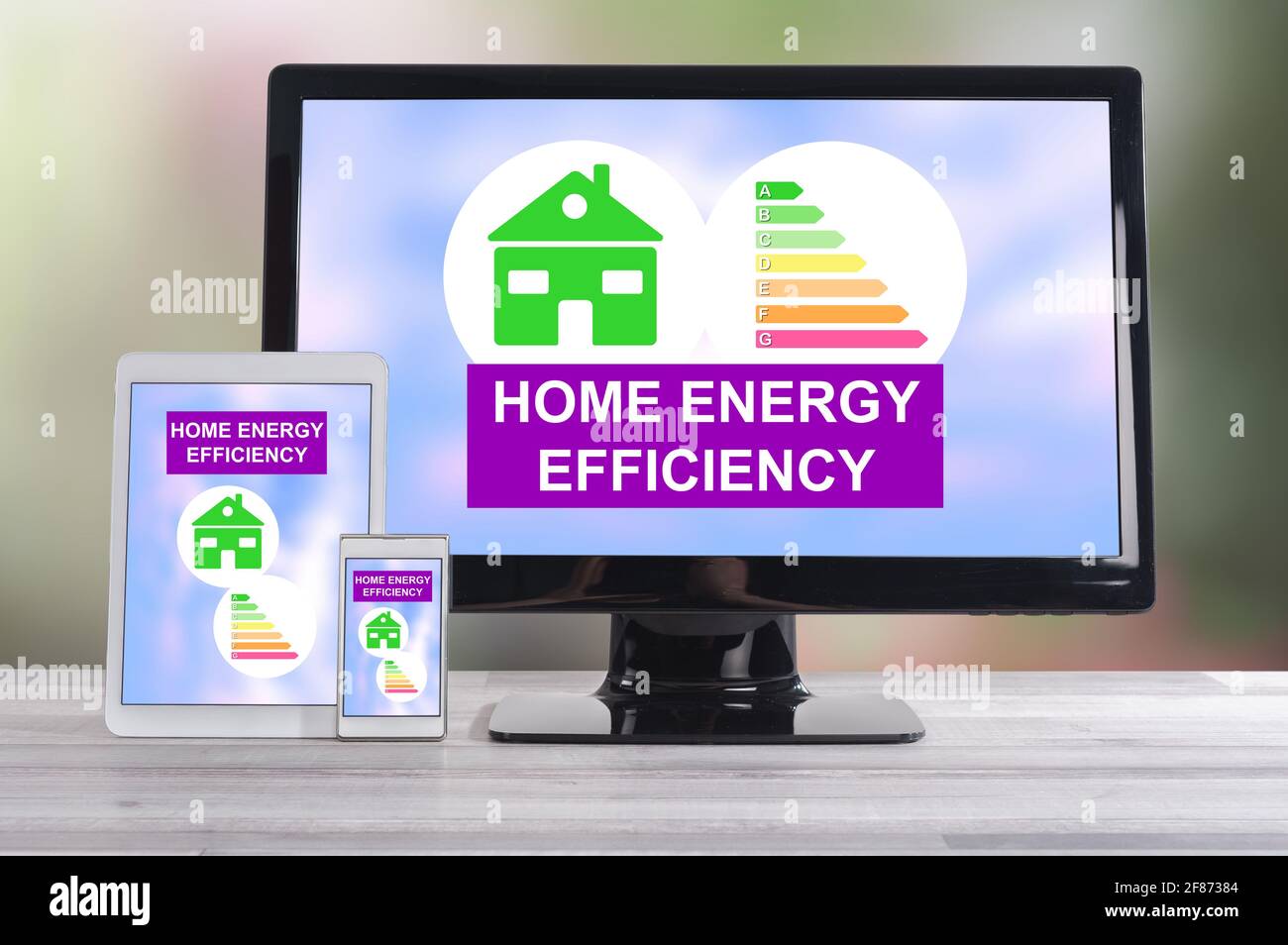 Home energy efficiency concept shown on different information technology devices Stock Photo